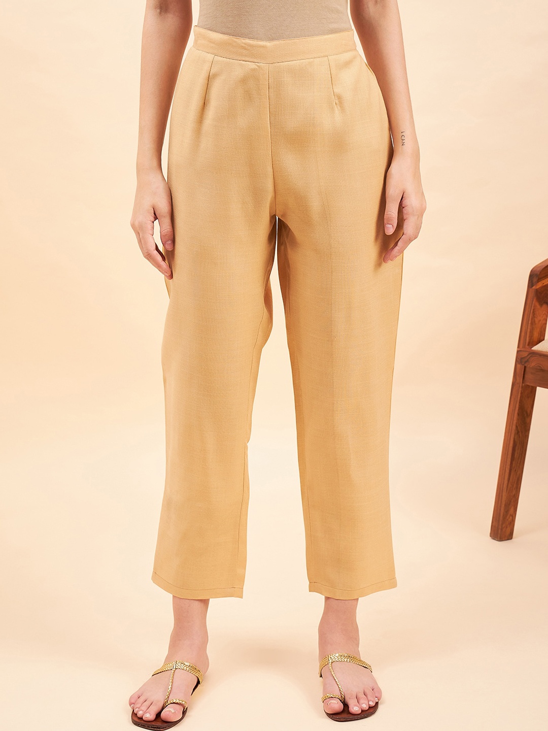 

Sangria Women Beige Mid-Rise Relaxed Straight Fit Cropped Trousers