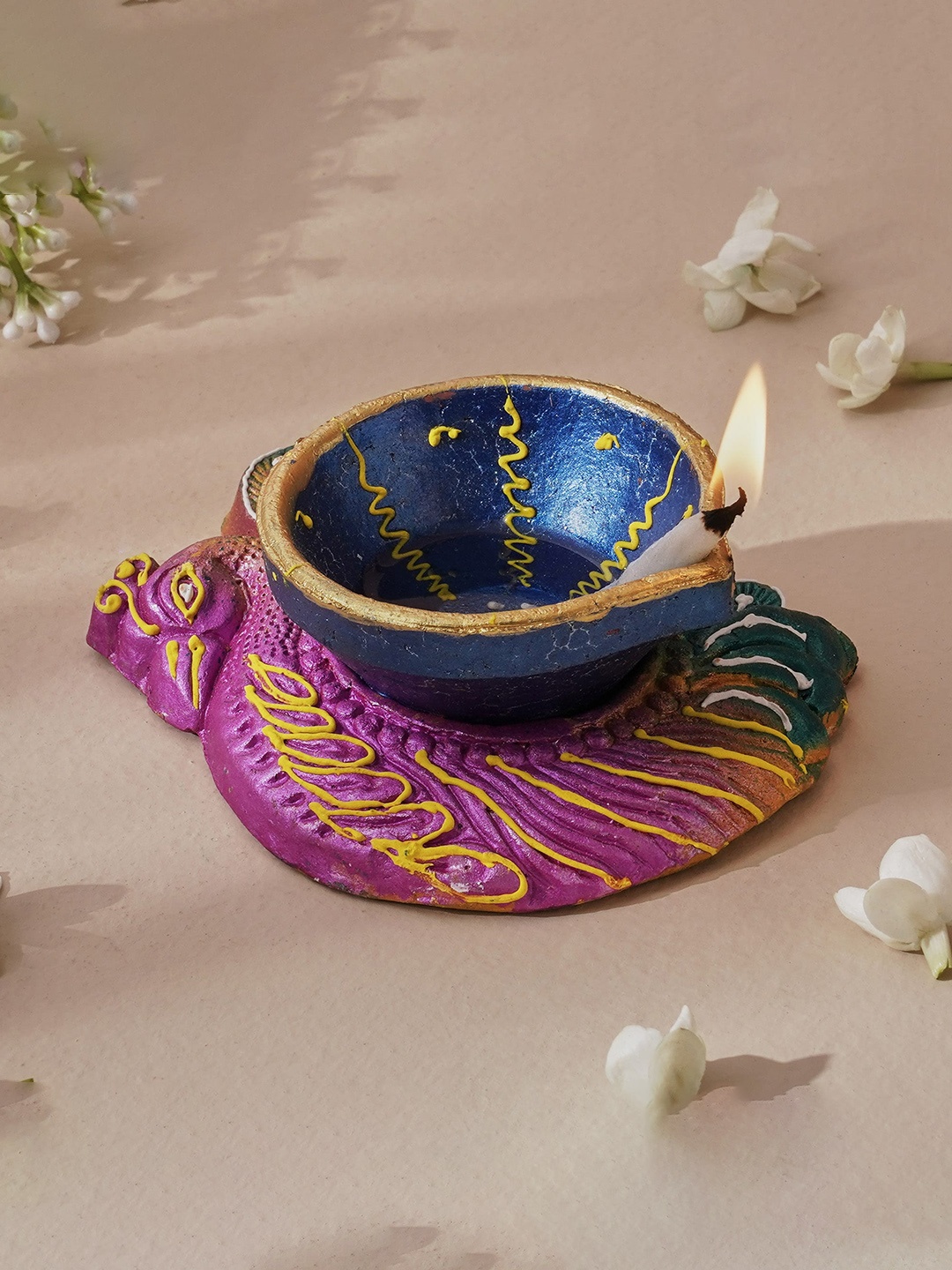 

Home Centre Blue Corsica Fest Terracotta Peacock Diya