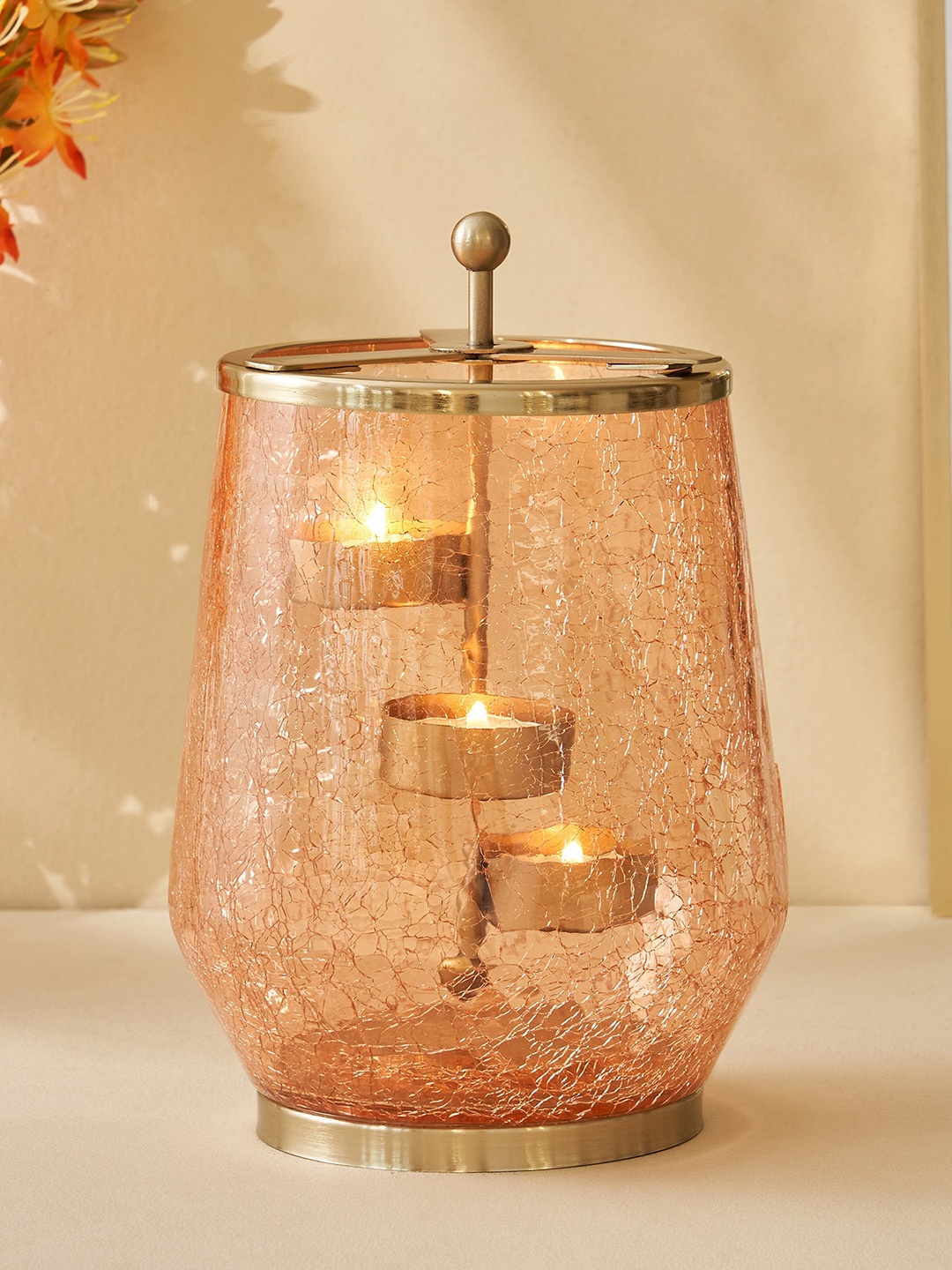 

Home Centre Brian Macia Peach Glass Crackle T-Light Holder