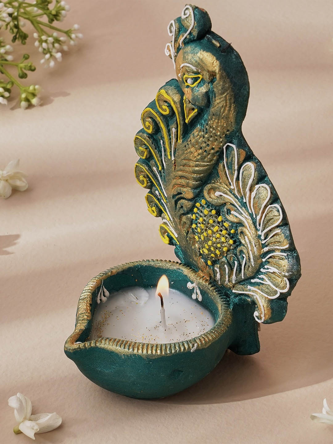 

Home Centre Corsica Fest Teal Green & Yellow Clay Peacock Diya Candle