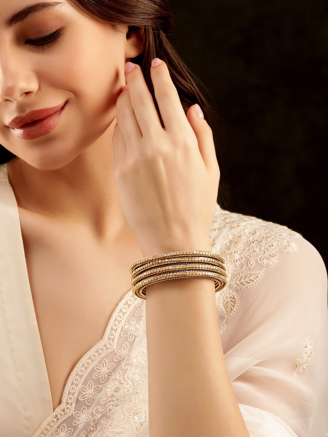 

Rubans Set of 4 Gold Plated Stone Studded Antique Bangles