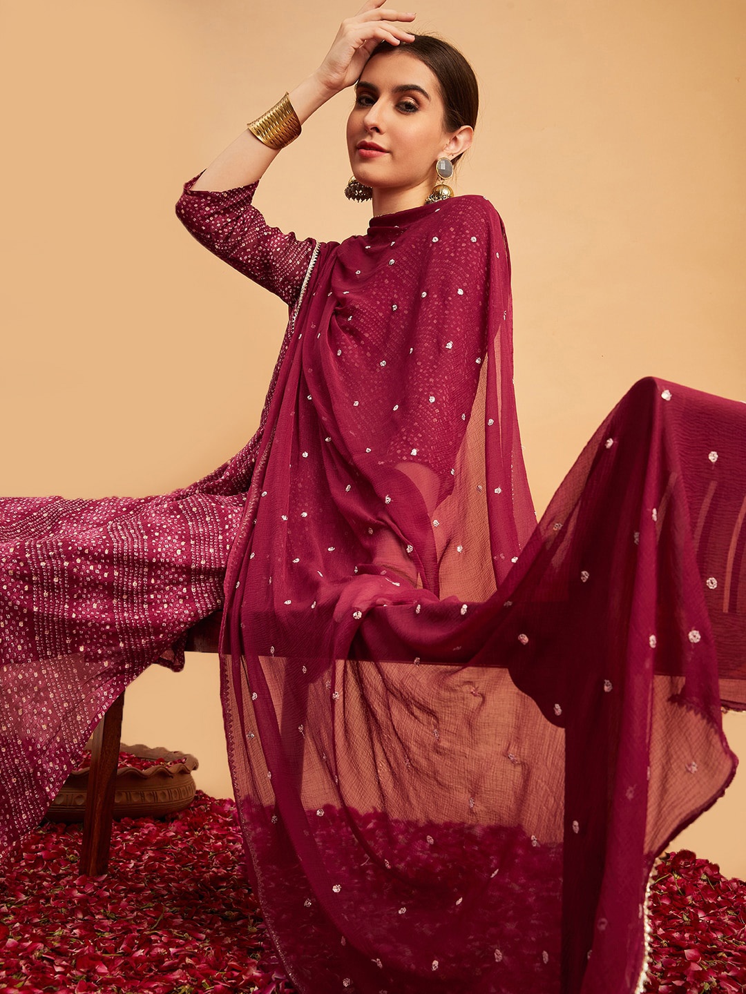 

Sangria Maroon Bandhani Printed Mirror Work A-Line Kurta With Trouser & Dupatta
