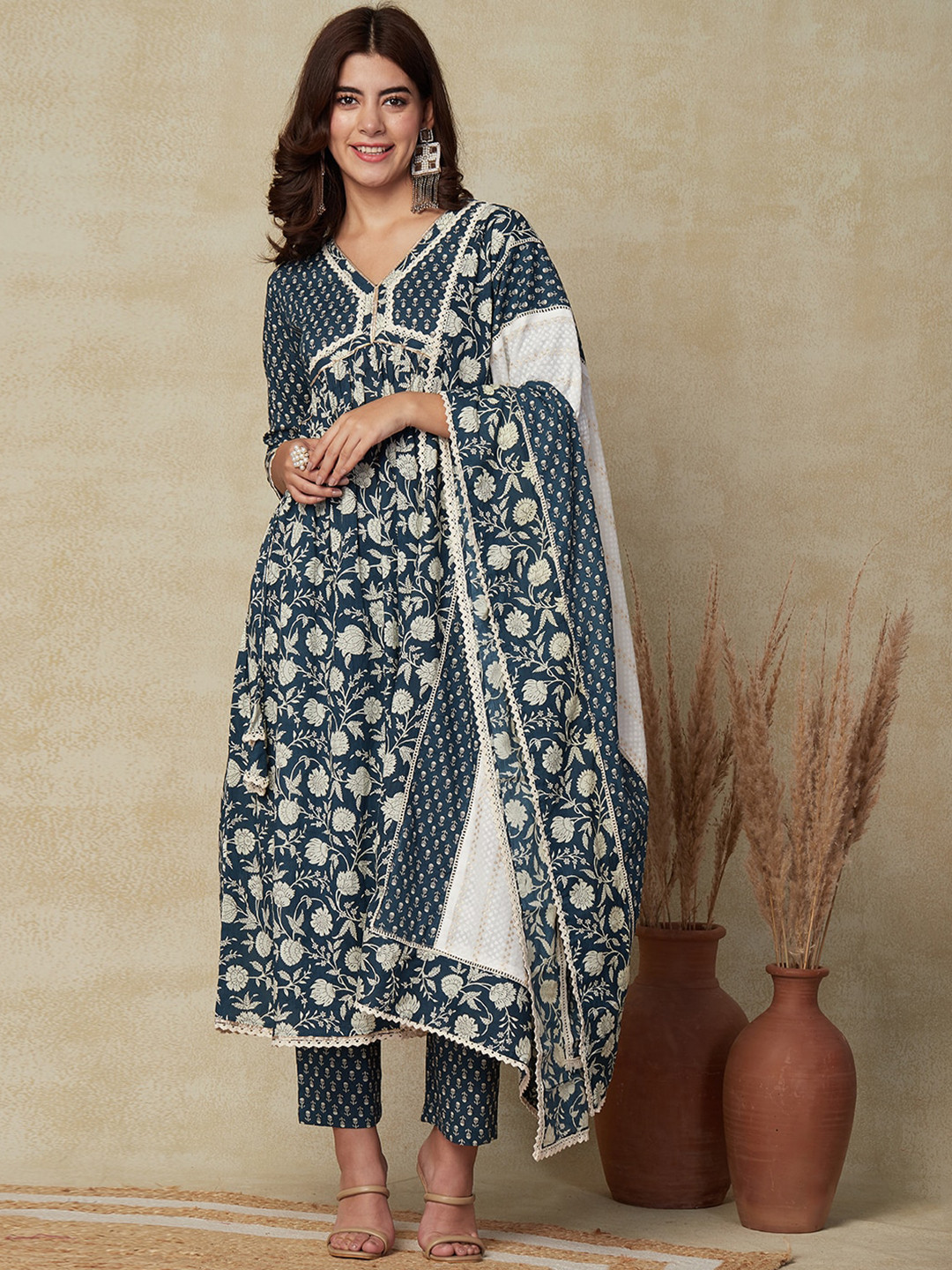 

FASHOR Teal Floral Printed V-Neck A-Line Pleated Kurta With Trousers & Dupatta