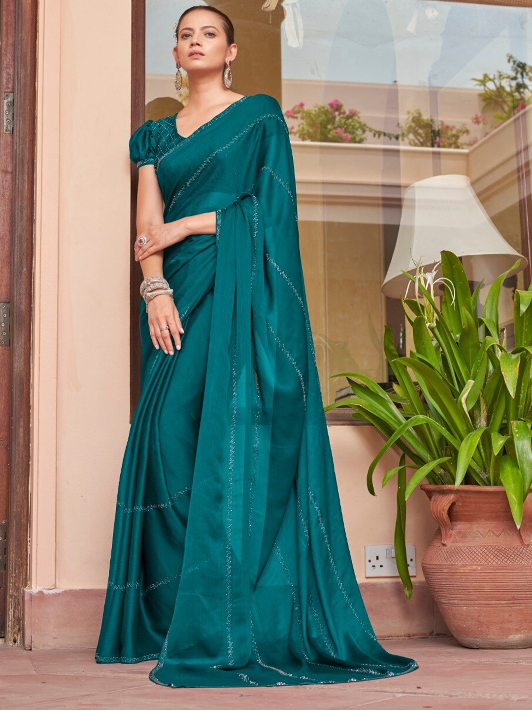 

Mitera Teal Blue Embellished Stone Work Saree