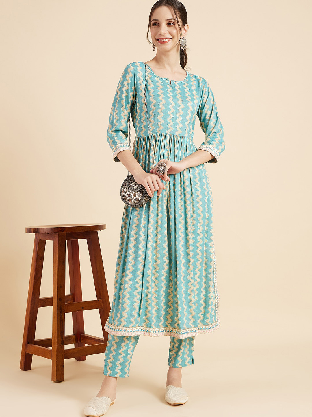 

Sangria Turquoise Blue Geometric Printed Mirror Work Pleated A-Line Kurta & Trouser