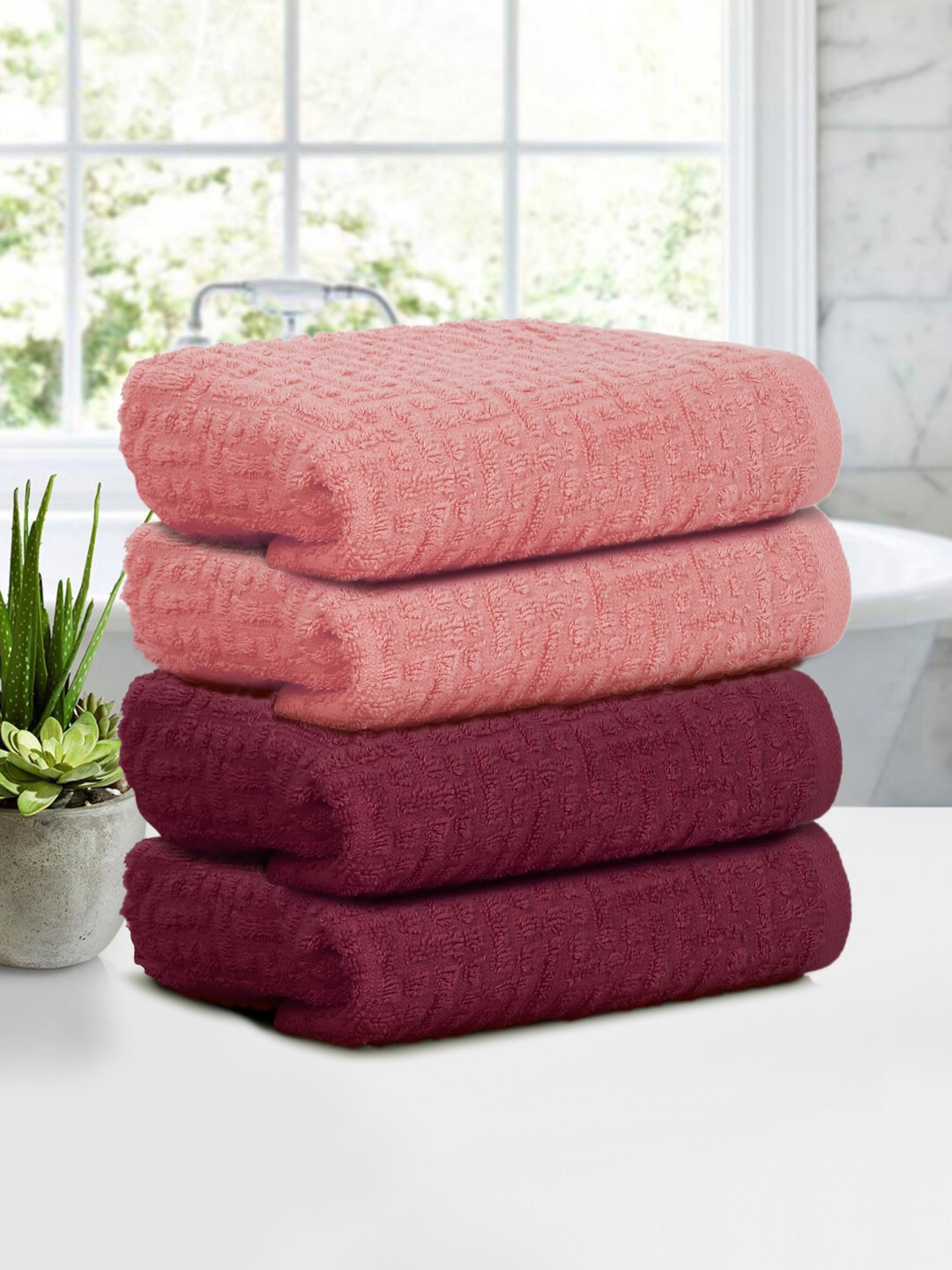 

Cortina Peach Coloured & Maroon 4 Pieces Jacquard 500 GSM Hand Towels