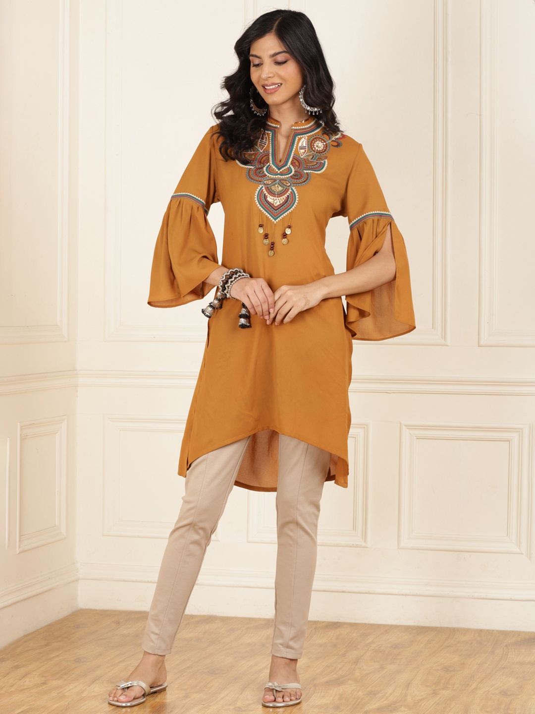 

Lakshita Ethnic Motifs Embroidered Mandarin Collar Bell Sleeves Sequinned High-Low Kurta, Mustard