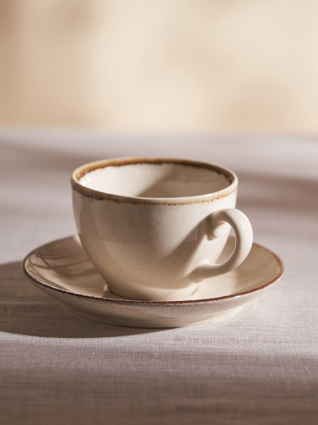 

Pure Home and Living 2 Pcs Beige Solid Porcelain Glossy Cup and Saucer - 250 ML Each