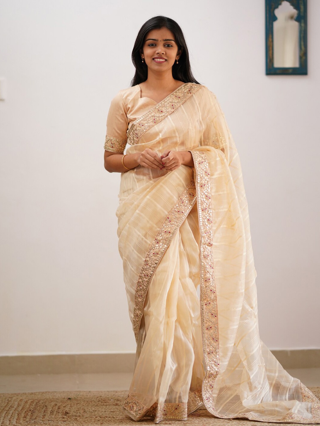 

Mitera Beige & Gold-Toned Striped Embroidered Saree