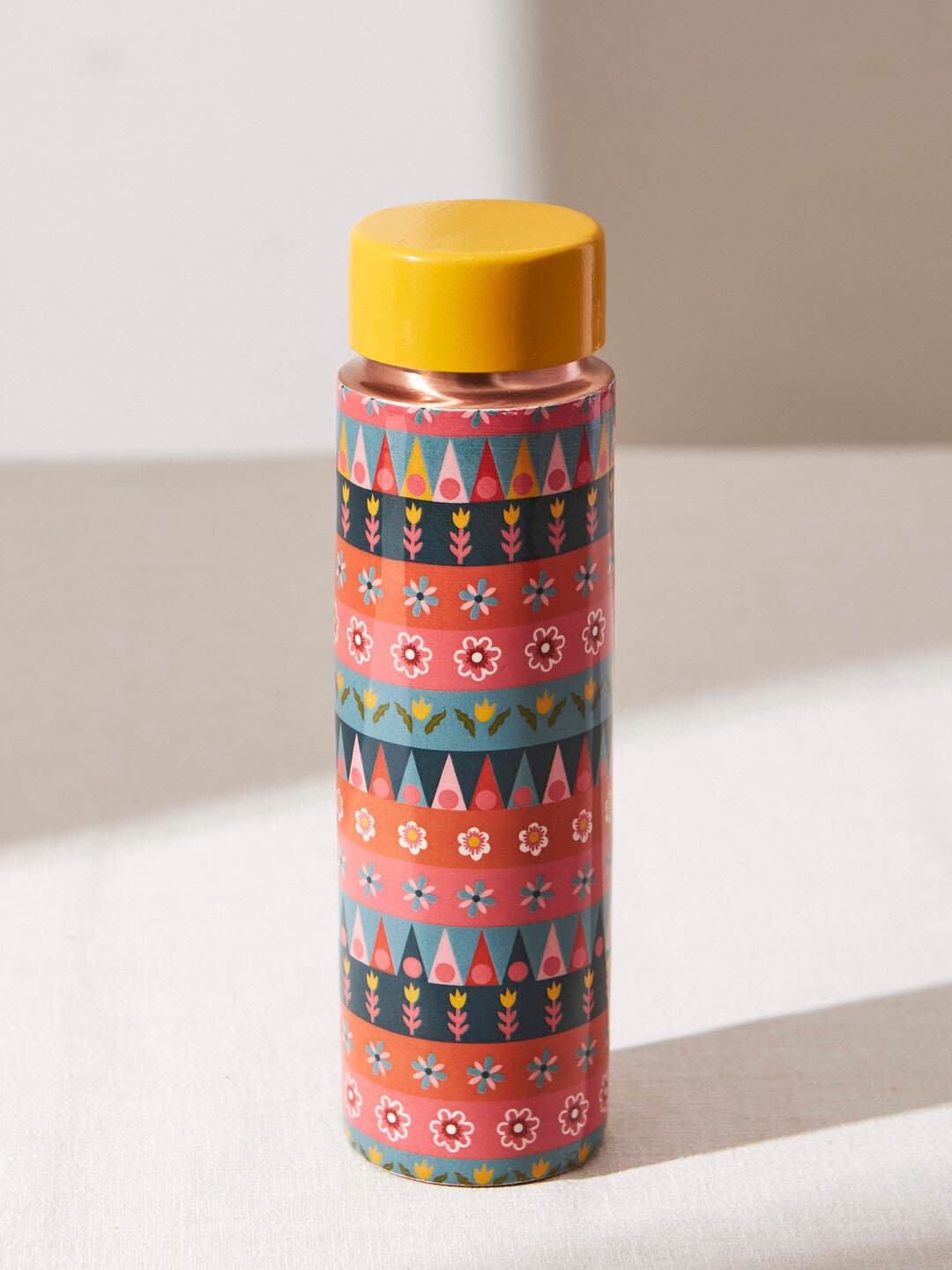 

Chumbak Marigold Assorted Printed Copper Water Bottle