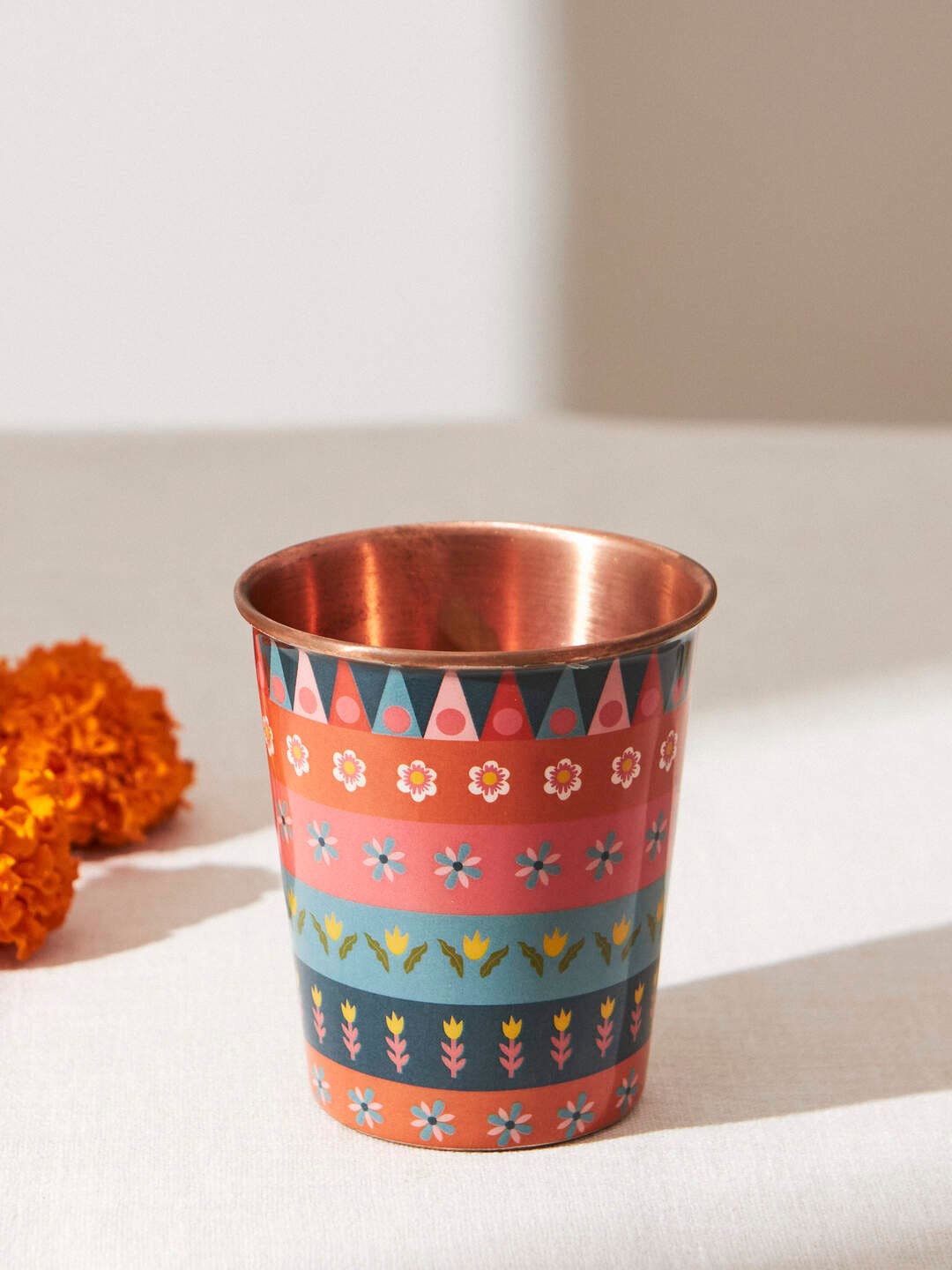 

Chumbak Marigold Assorted Printed Copper Mini Tumbler
