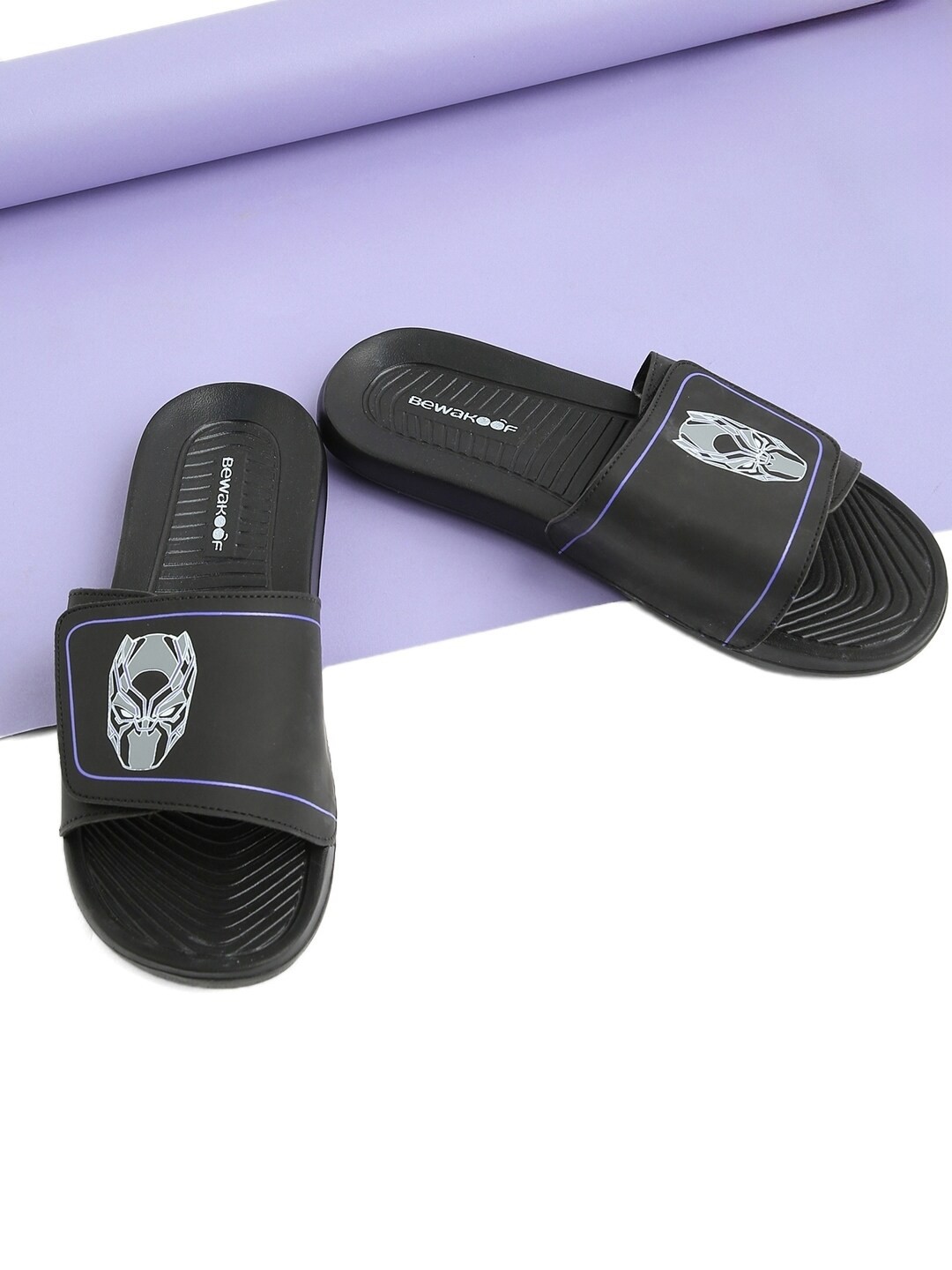 

Bewakoof Men Black Panther Printed Rubber Sliders