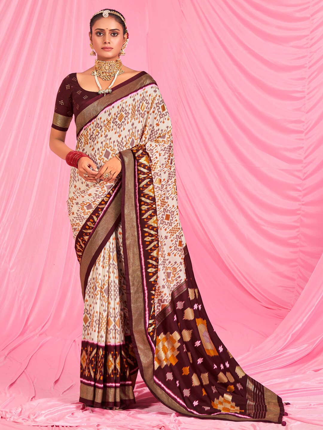 

Saree mall Off White & Brown Ethnic Motifs Printed Zari Ikat Sarees