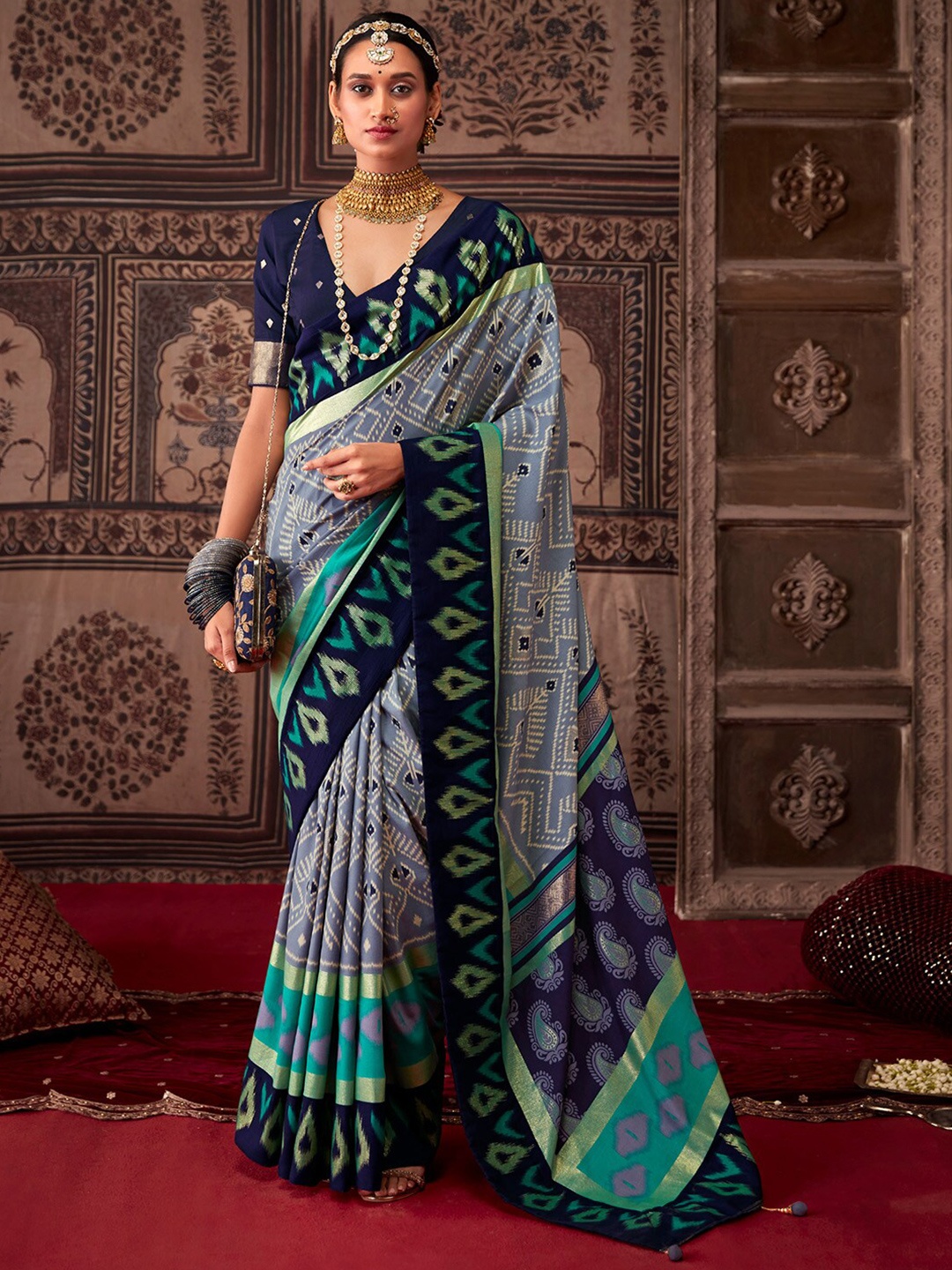

Saree mall Grey & Blue Ethnic Motifs Printed Zari Patola Sarees