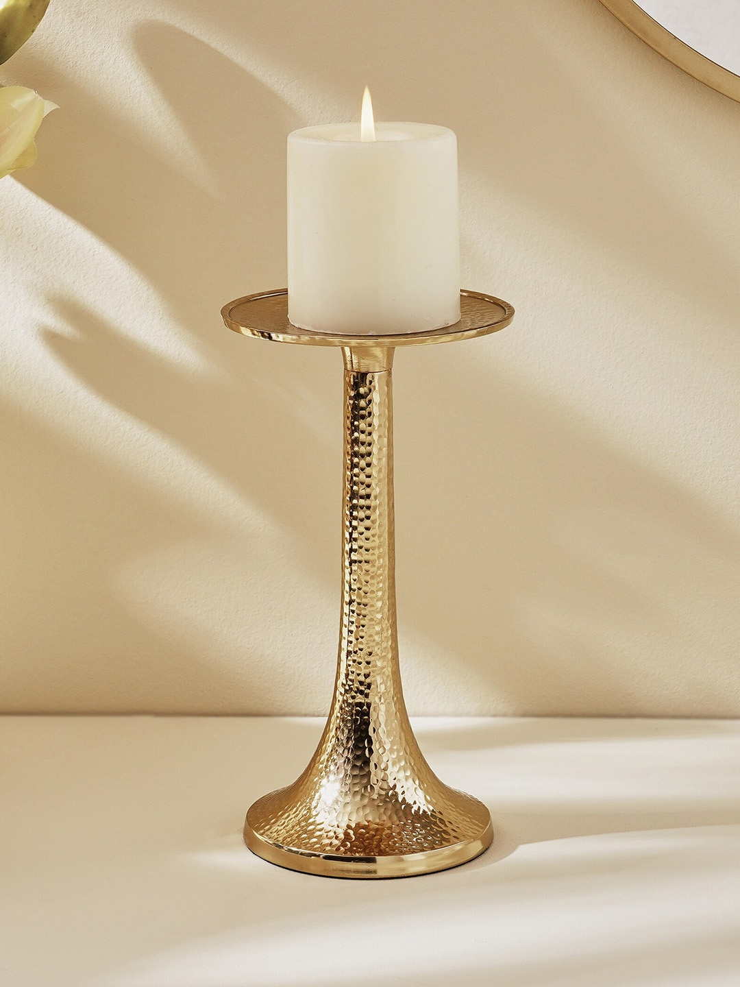 

Home Centre Splendid Gold Toned Rush Yellow Gisela Metal Hammered Candle Stand