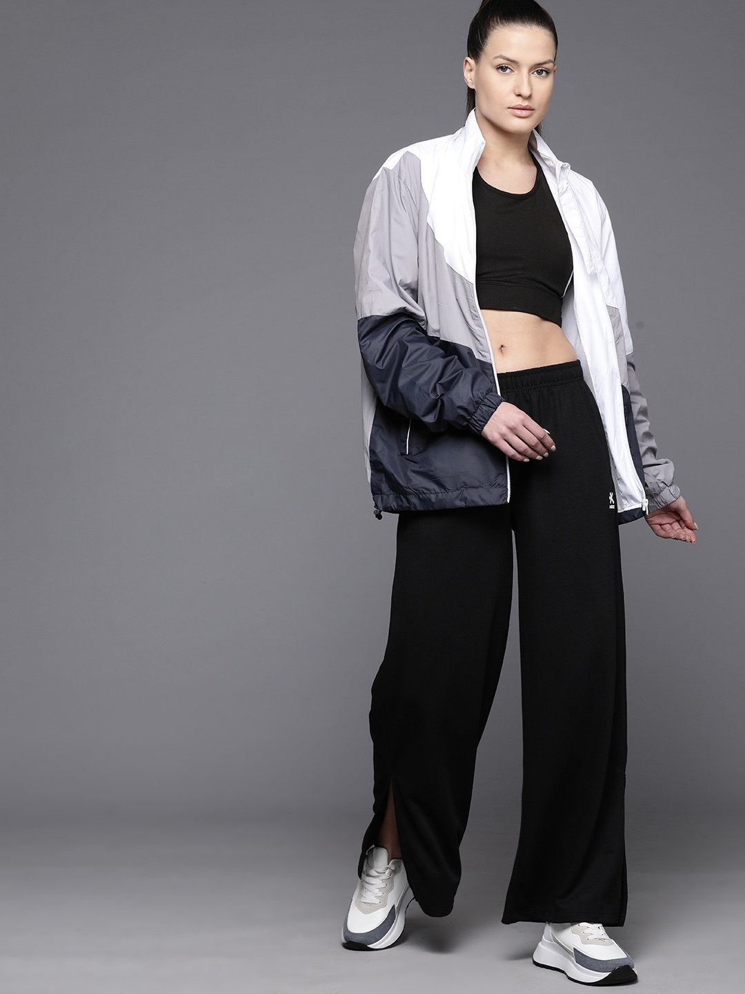 

HRX by Hrithik Roshan Women Flared Slits Lifestyle Track Pants, Black