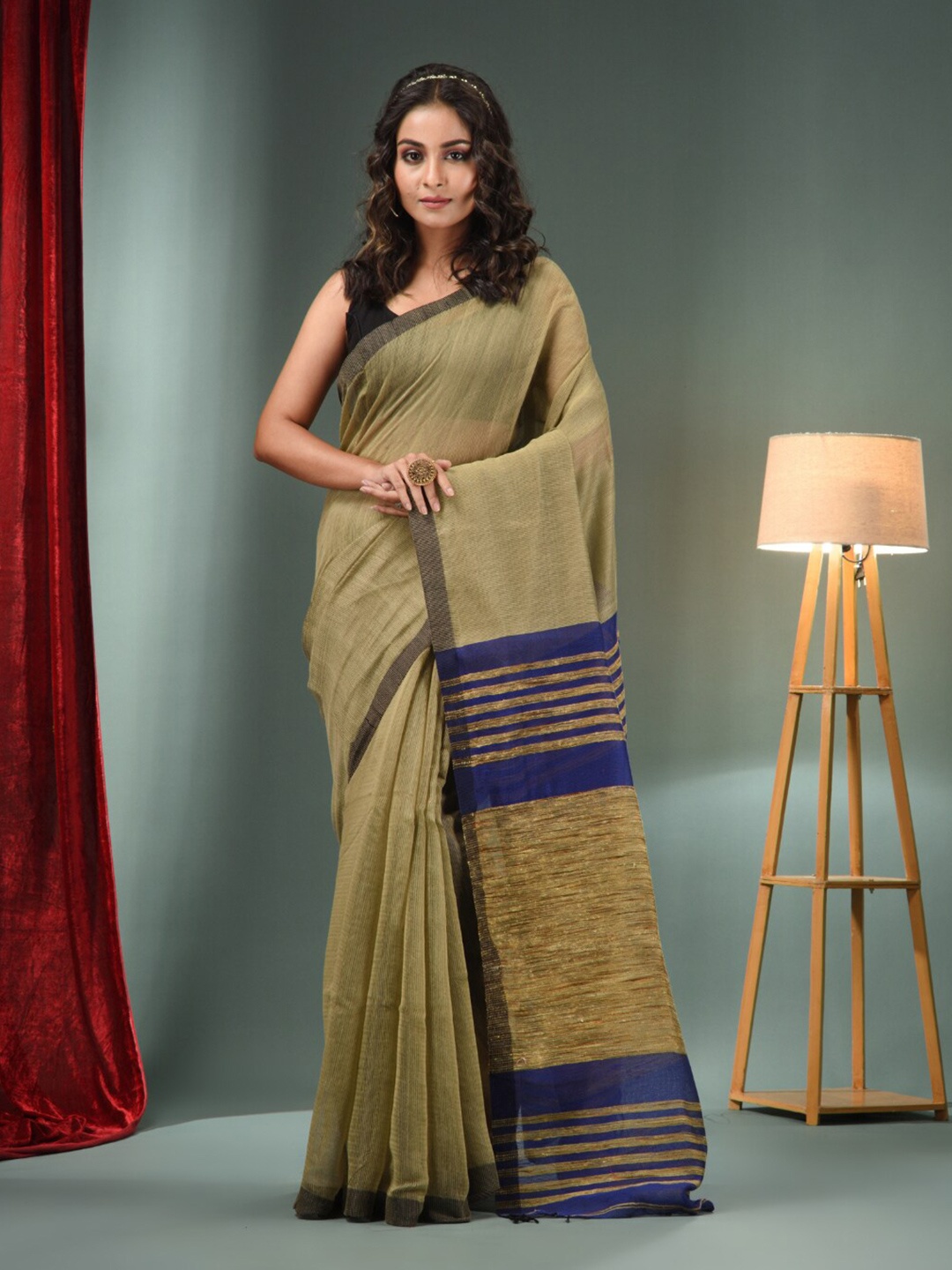 

Charukriti Beige Navy Blue Striped Saree
