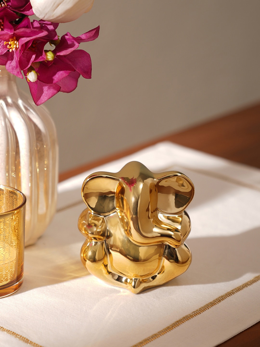 

Pure Home and Living Yellow Ceramic Ganesha Figurine Showpiece, Gold