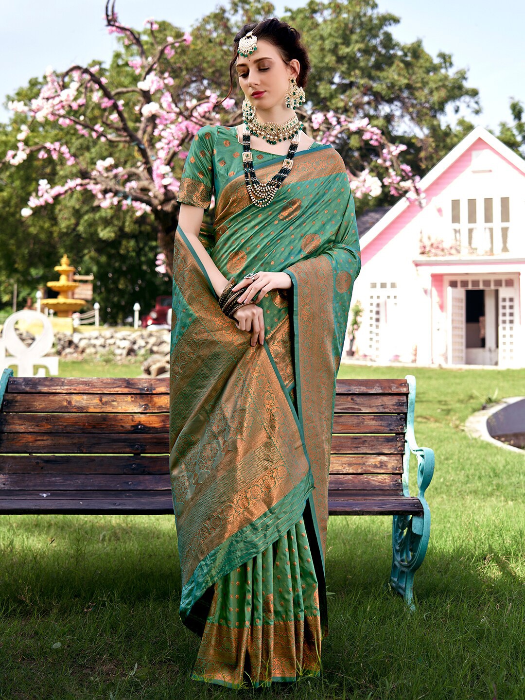

Anouk Turquoise Blue & Gold-Toned Ethnic Motifs Woven Design Zari Saree