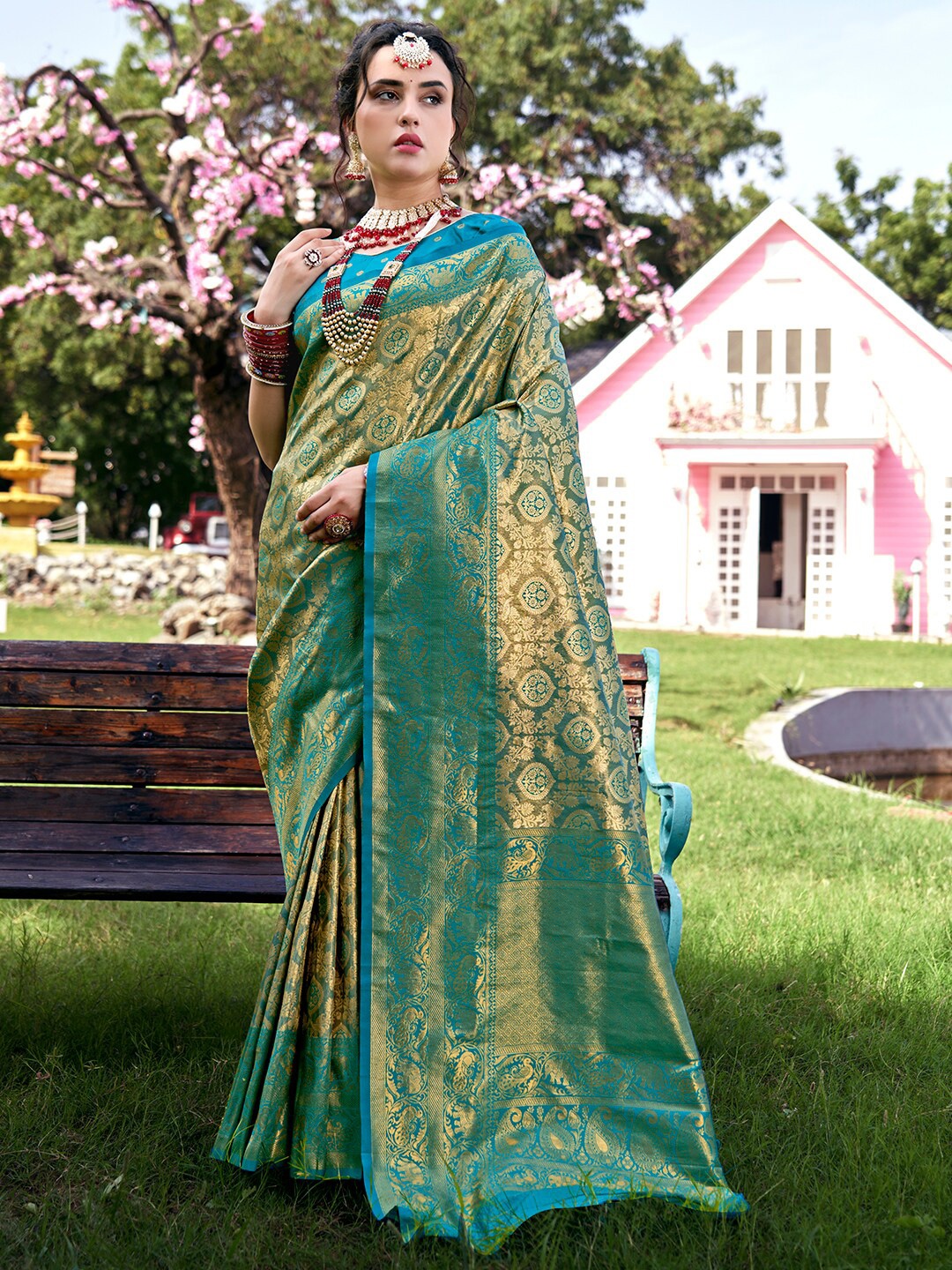 

Anouk Turquoise Blue & Green Ethnic Motifs Woven Design Zari Kanjivaram Saree