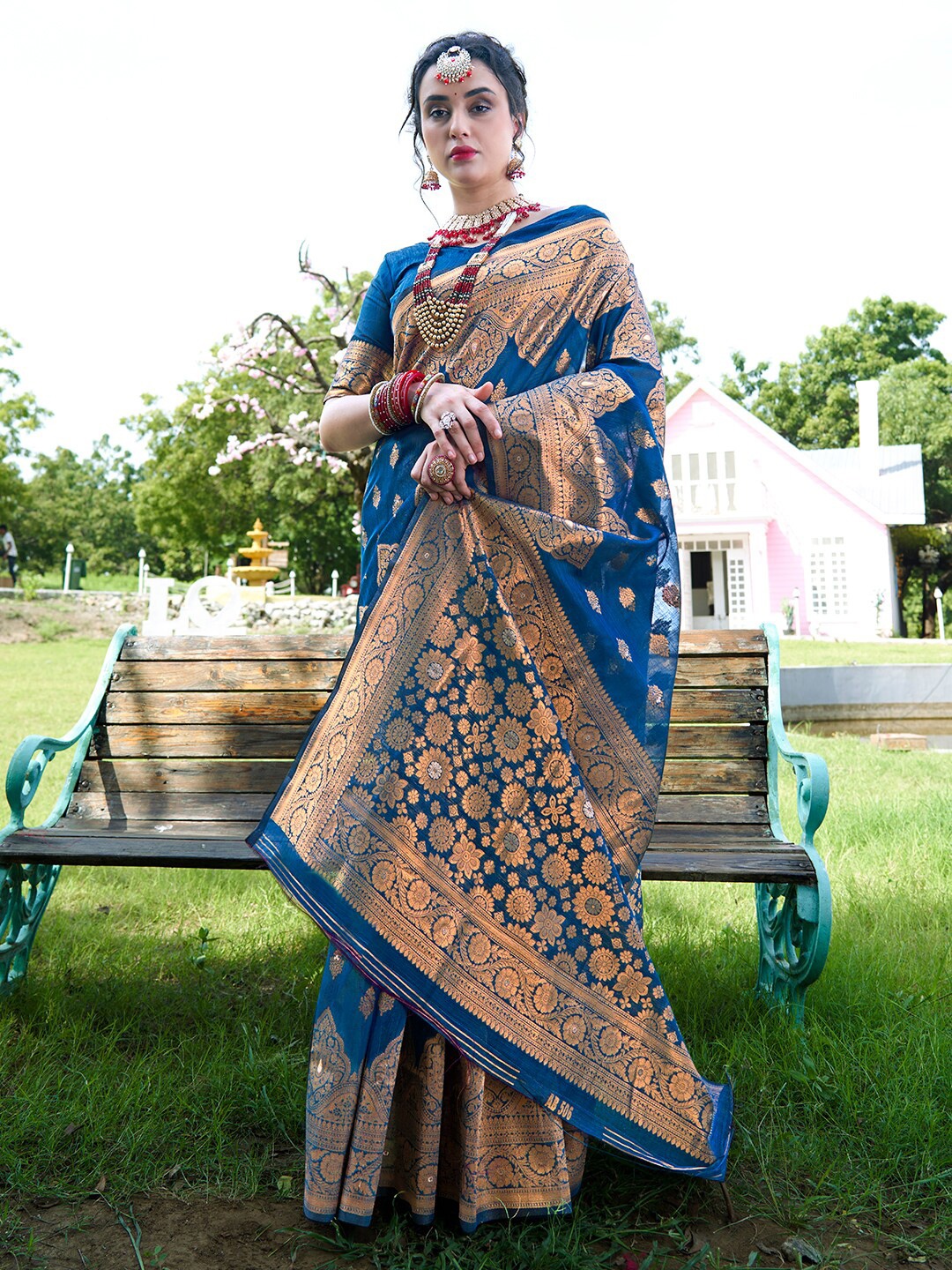 

Anouk Turquoise Blue & Gold-Toned Ethnic Motifs Woven Design Zari Organza Saree