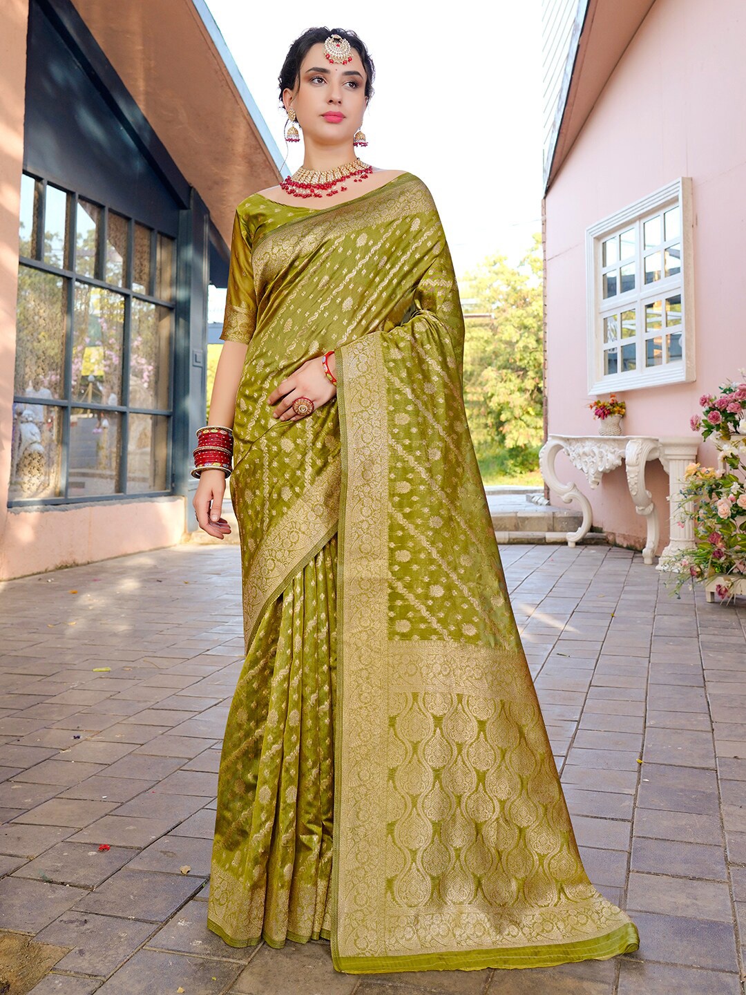 

Anouk Lime Green Ethnic Motifs Woven Design Zari Organza Saree