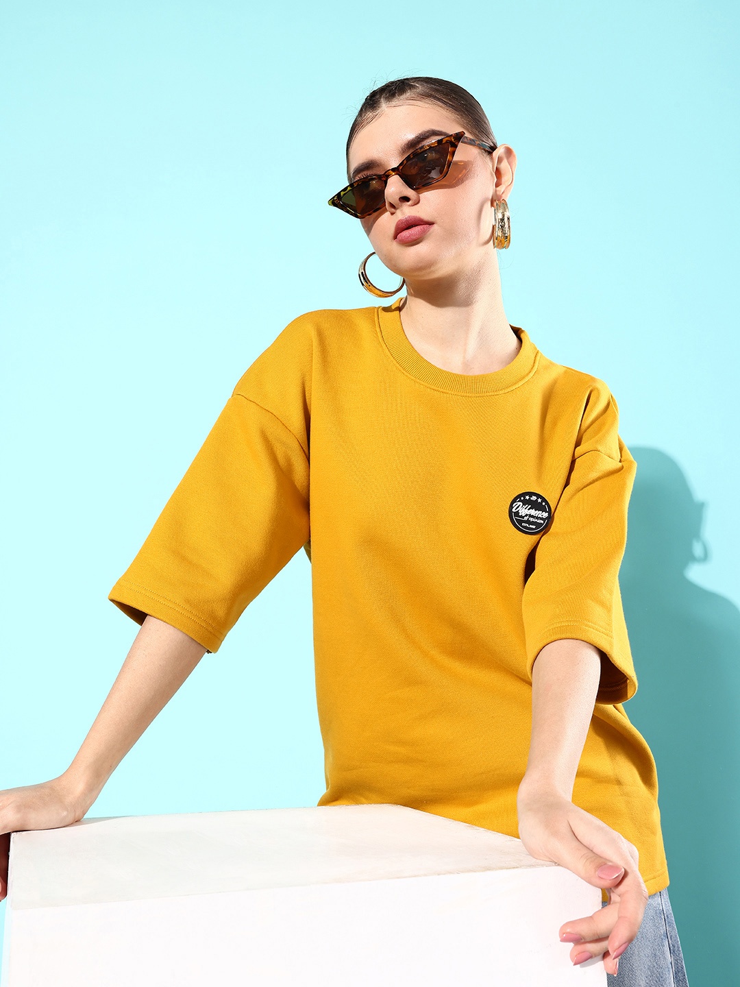 

Difference of Opinion Women Solid Sweatshirt, Mustard