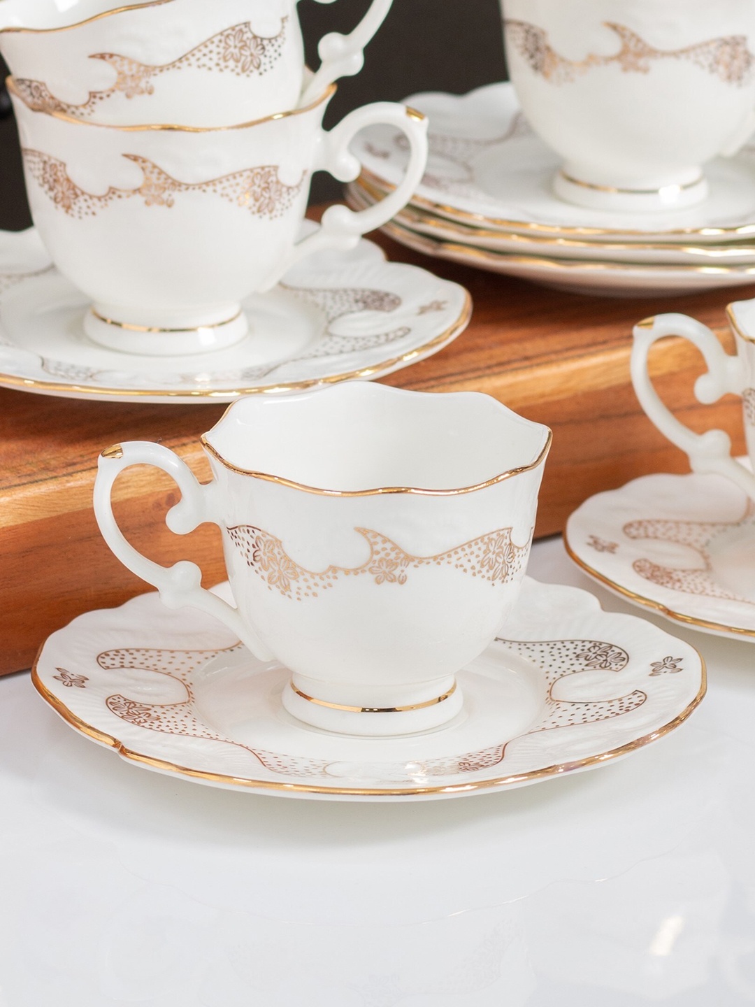 

CLAY CRAFT Premium White & Beige 12 Pieces Printed Ceramic Glossy Cups and Saucers