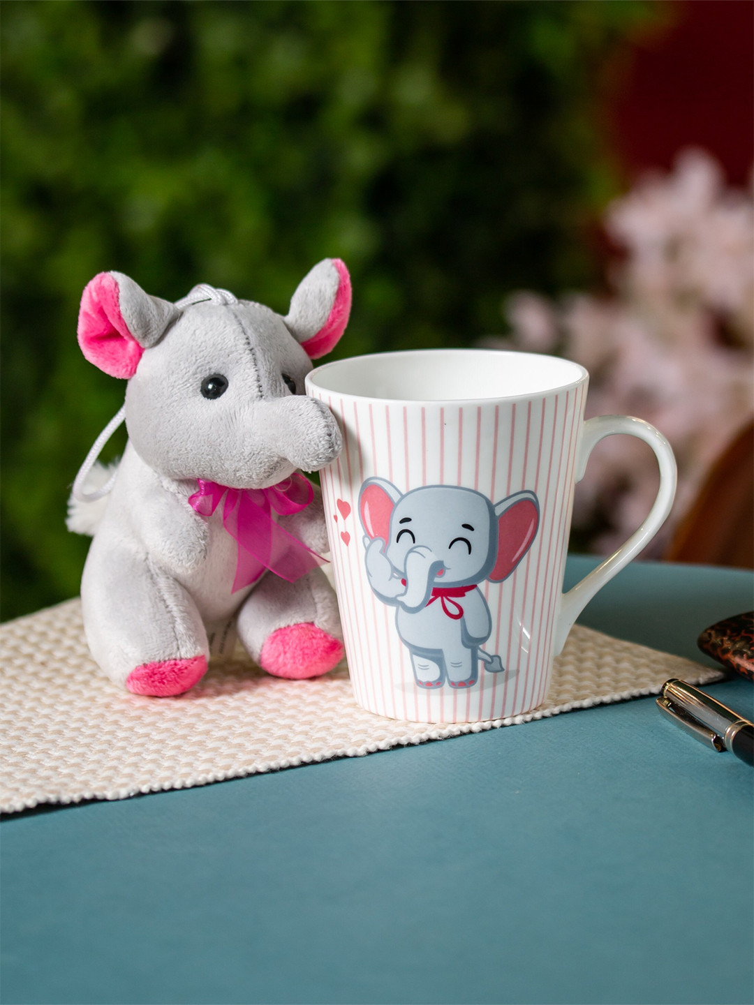 

CLAY CRAFT White & Grey Printed Ceramic Glossy Milk Mug With Toy - 340 ML