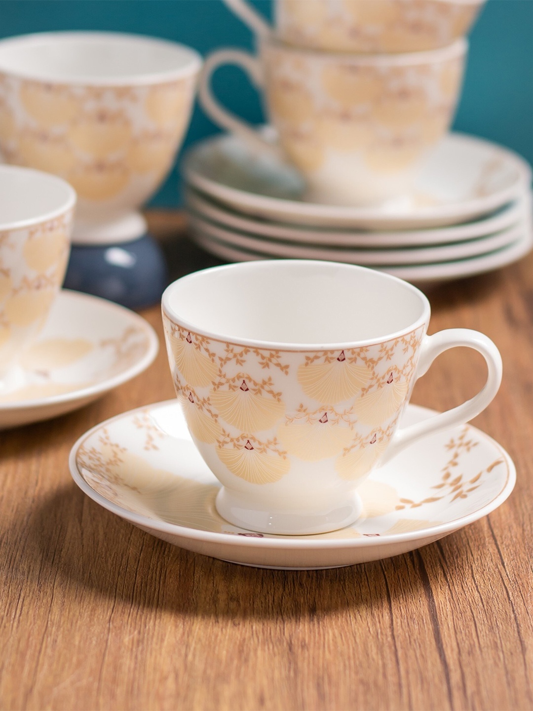 

CLAY CRAFT White & Beige Printed 12 Pieces Ceramic Glossy Cups And Saucers - 180 ML Each