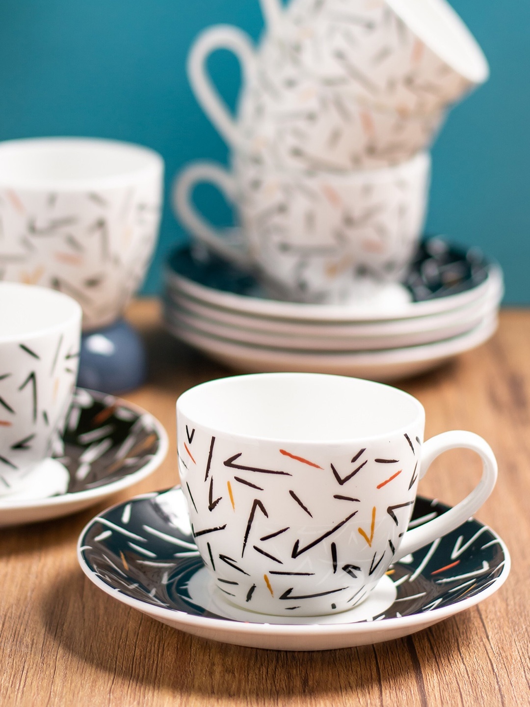 

CLAY CRAFT 12 Pcs White & Black Printed Ceramic Glossy Cups and Saucers - 180 ML Each