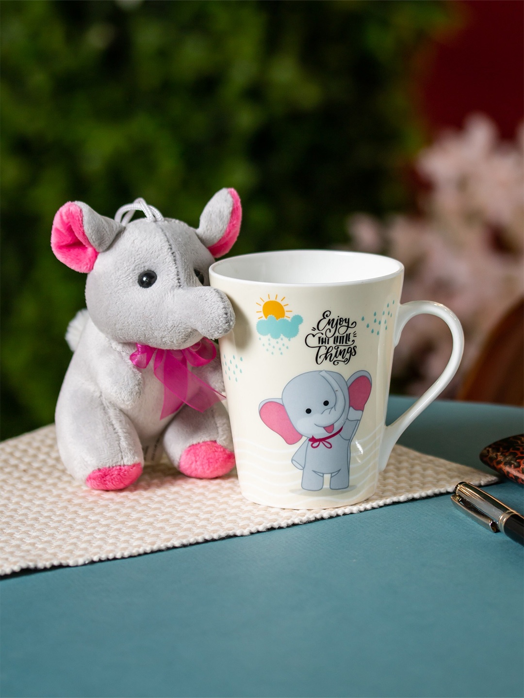 

CLAY CRAFT White & Grey Printed Ceramic Glossy Mug with Elephant Toy - 340 ML