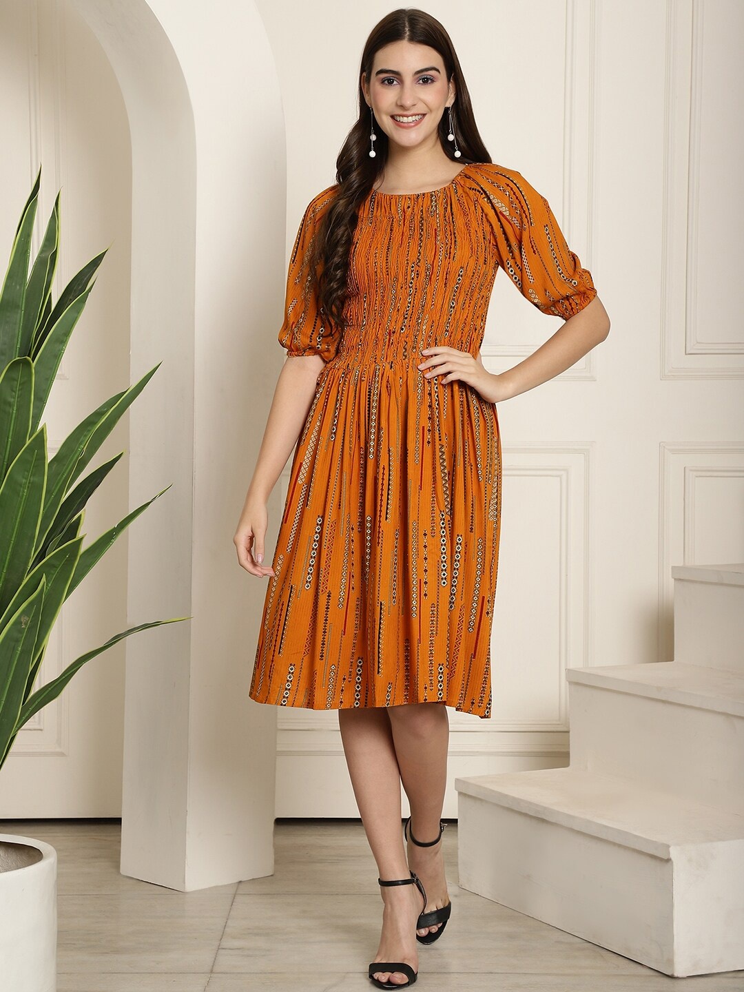 

Aawari Geometric Printed Puff Sleeves Gathered Detailed Fit & Flare Dress, Mustard