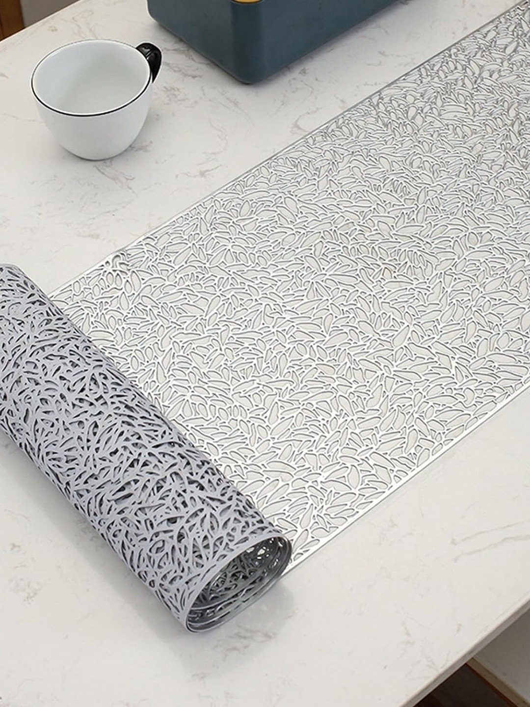 

Dakshya Industries Silver Toned Self Design Table Runner