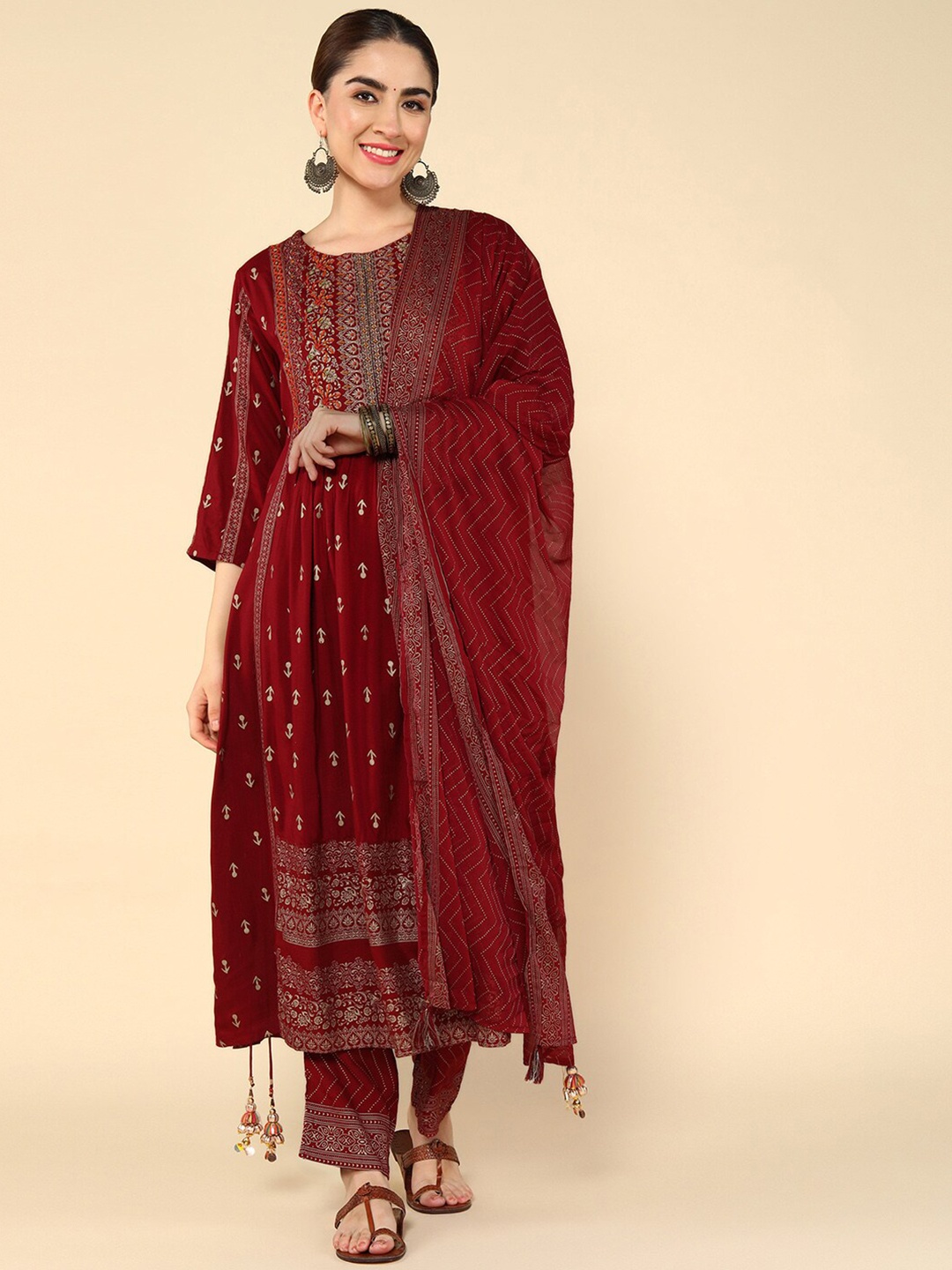 

aturabi Ethnic Motifs Printed Thread Work Pleated A-Line Kurta & Trouser With Dupatta, Maroon