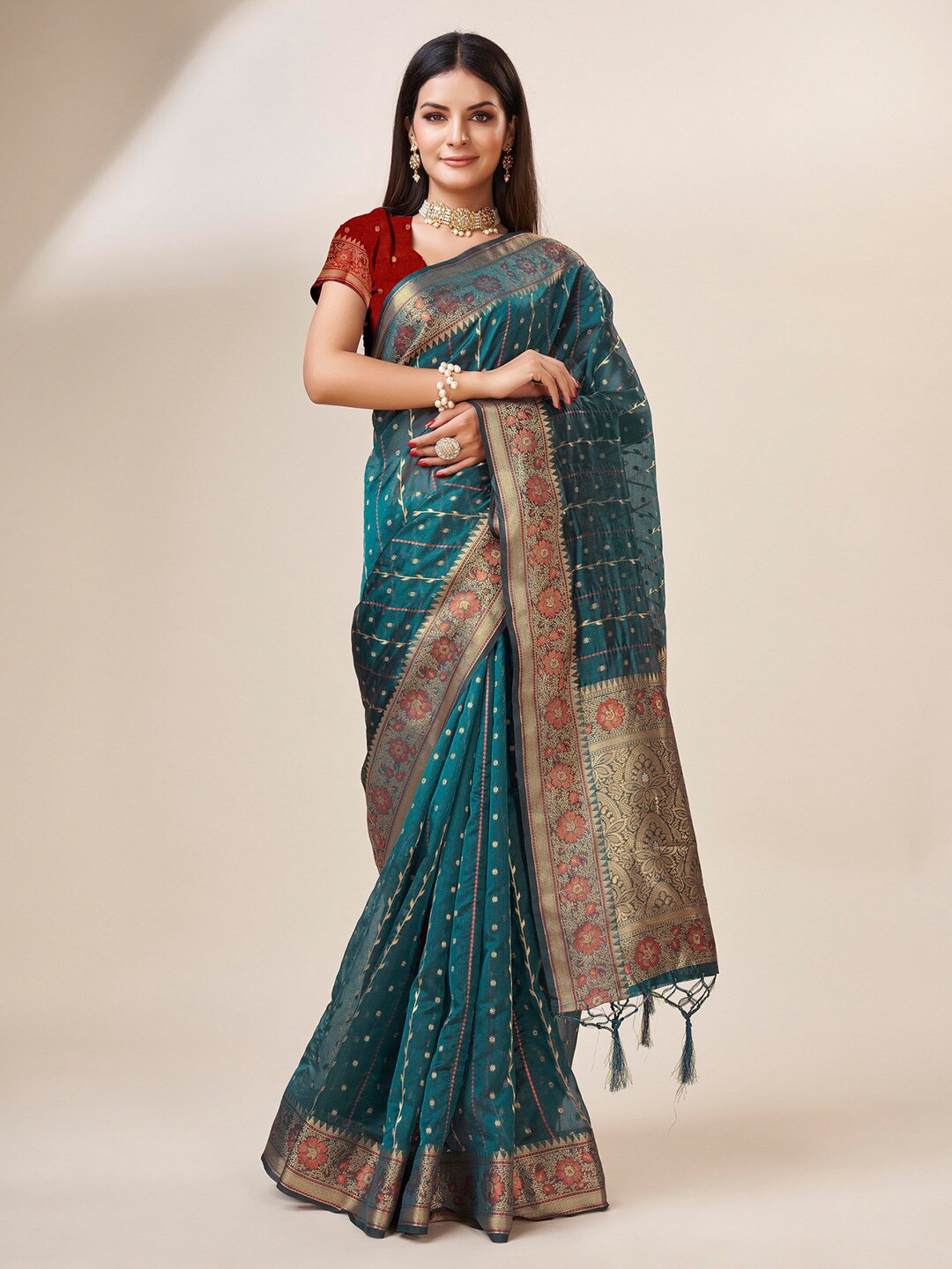 

Mitera Turquoise Blue & Gold-Toned Ethnic Motif Woven Design Zari Organza Saree