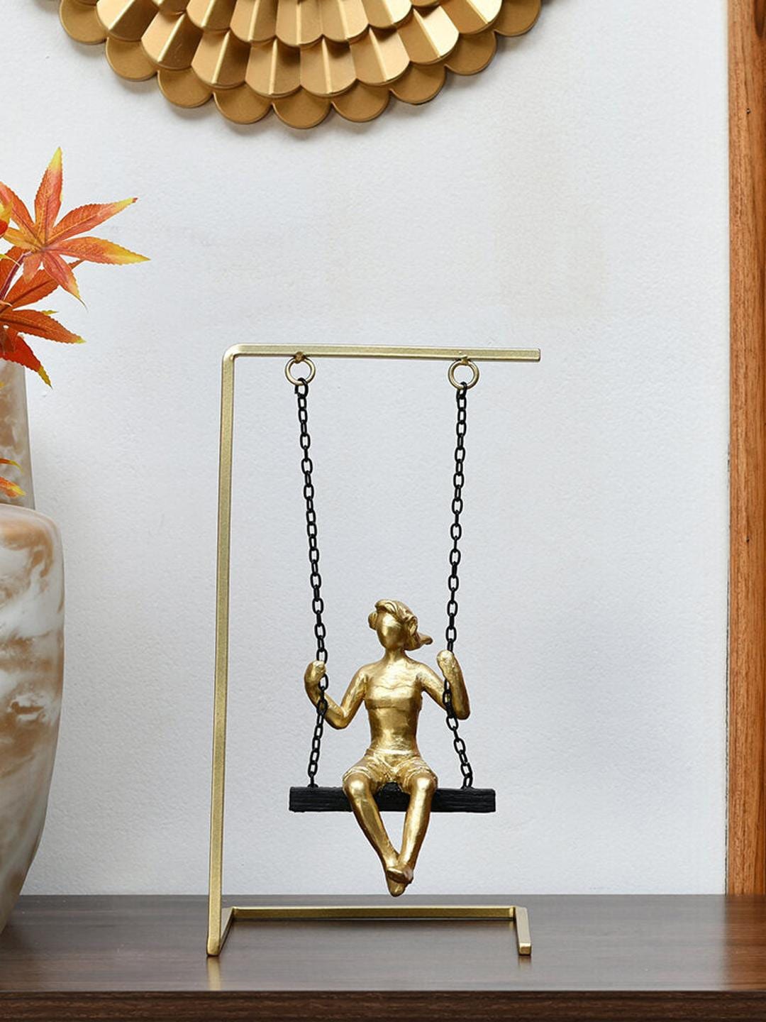 

Athome by Nilkamal Black & Gold Toned Lady On Swing Showpiece