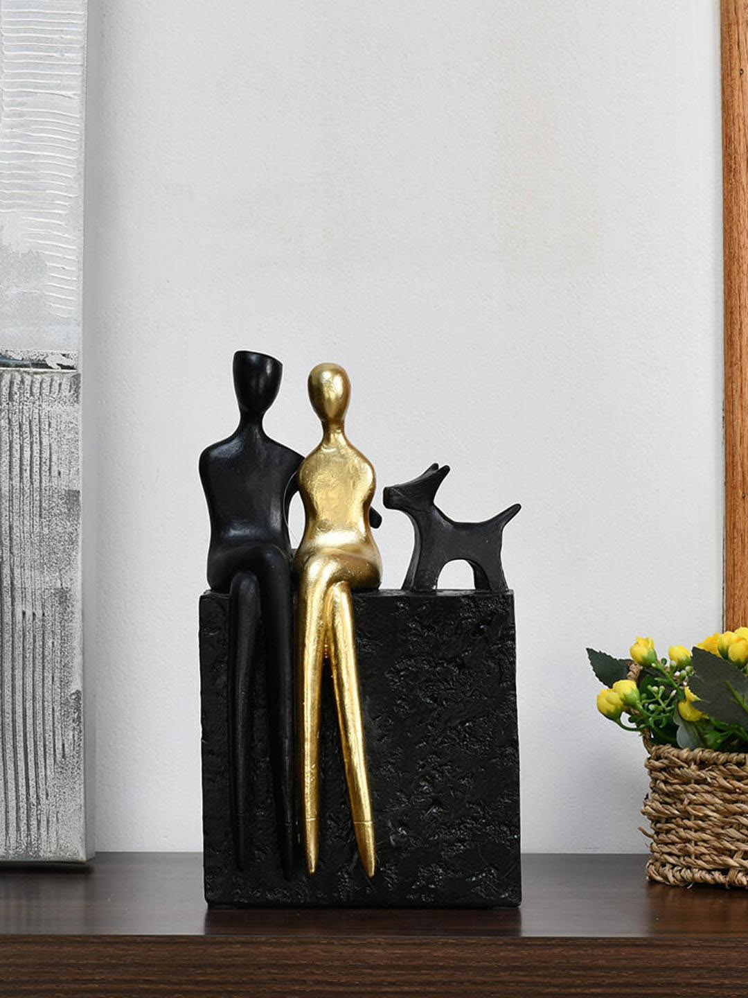 

Athome by Nilkamal Black & Gold Toned Couple With Dog Showpiece