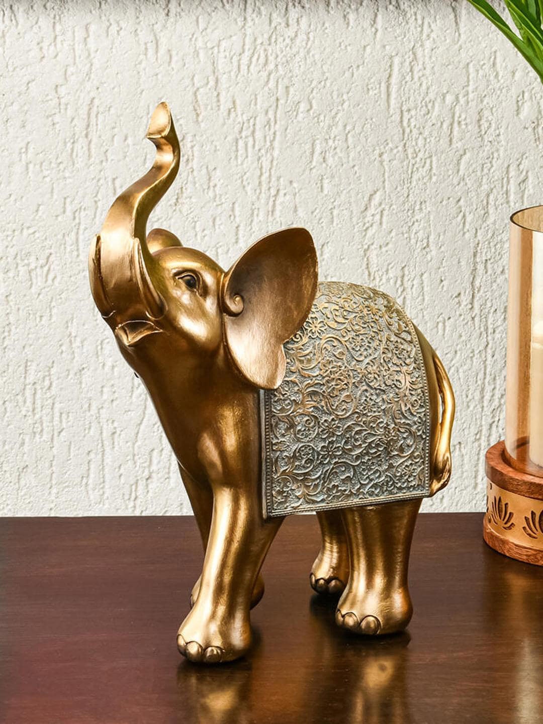 

Athome by Nilkamal Grey Textured Trunk Up Elephant Showpiece, Gold