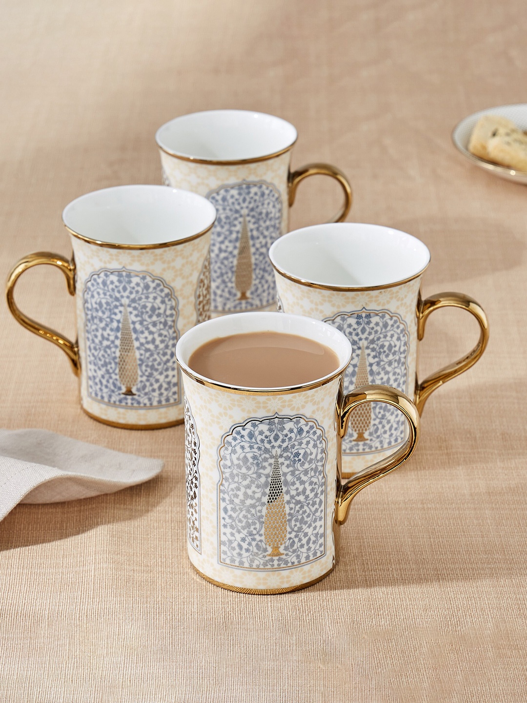 

Home Centre Corsica Ebony White 4 Pcs Ethnic Motifs Bone China Glossy Mugs - 370 ML Each