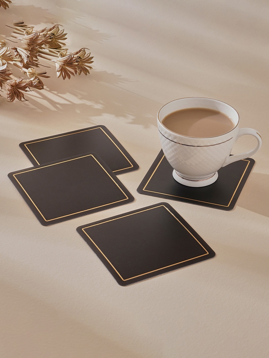 

Home Centre Andrey Black 4 Pieces Square Coasters