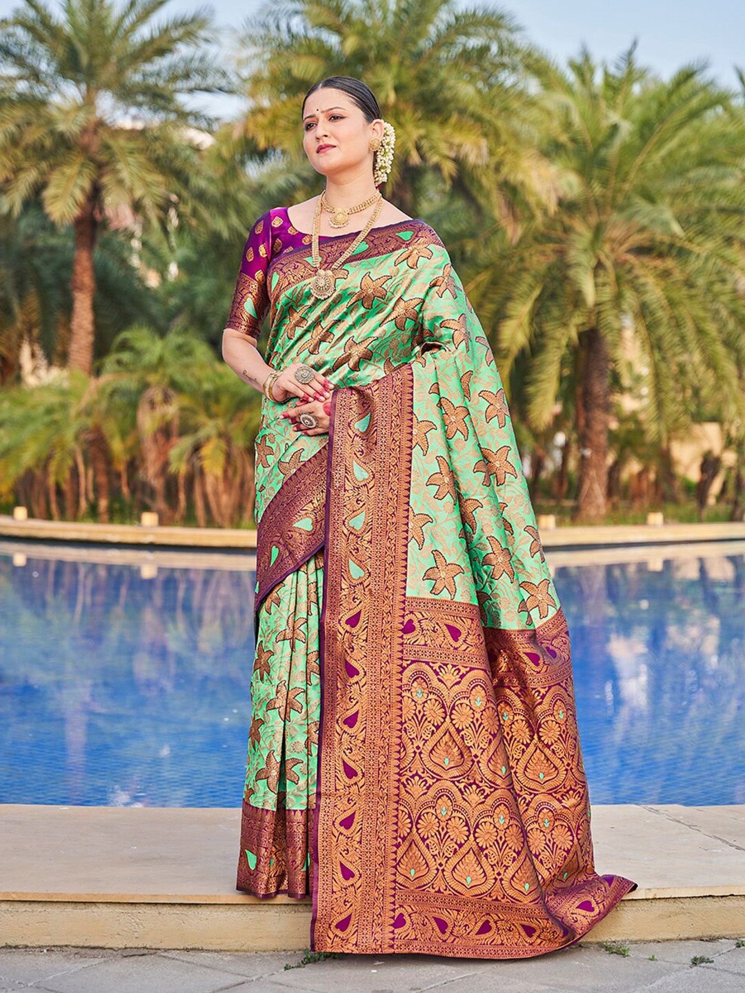 

Mitera Sea Green & Pink Ethnic Motif Woven Design Zari Banarasi Sarees