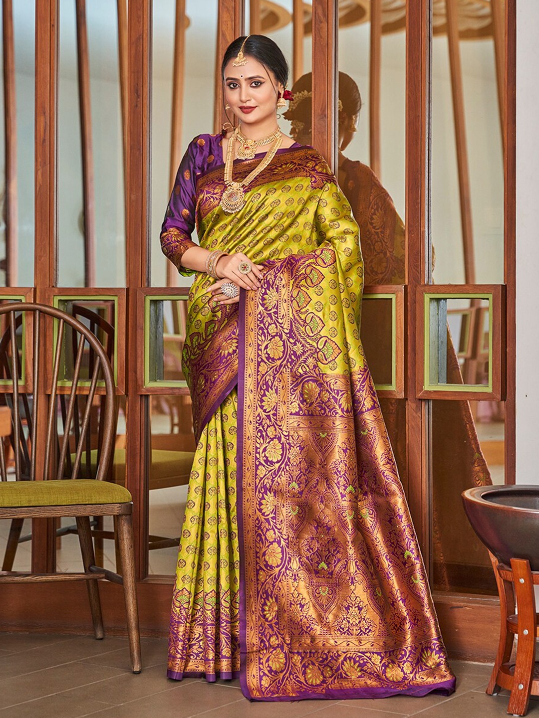 

Mitera Yellow & Purple Ethnic Motifs Woven Design Zari Banarasi Saree