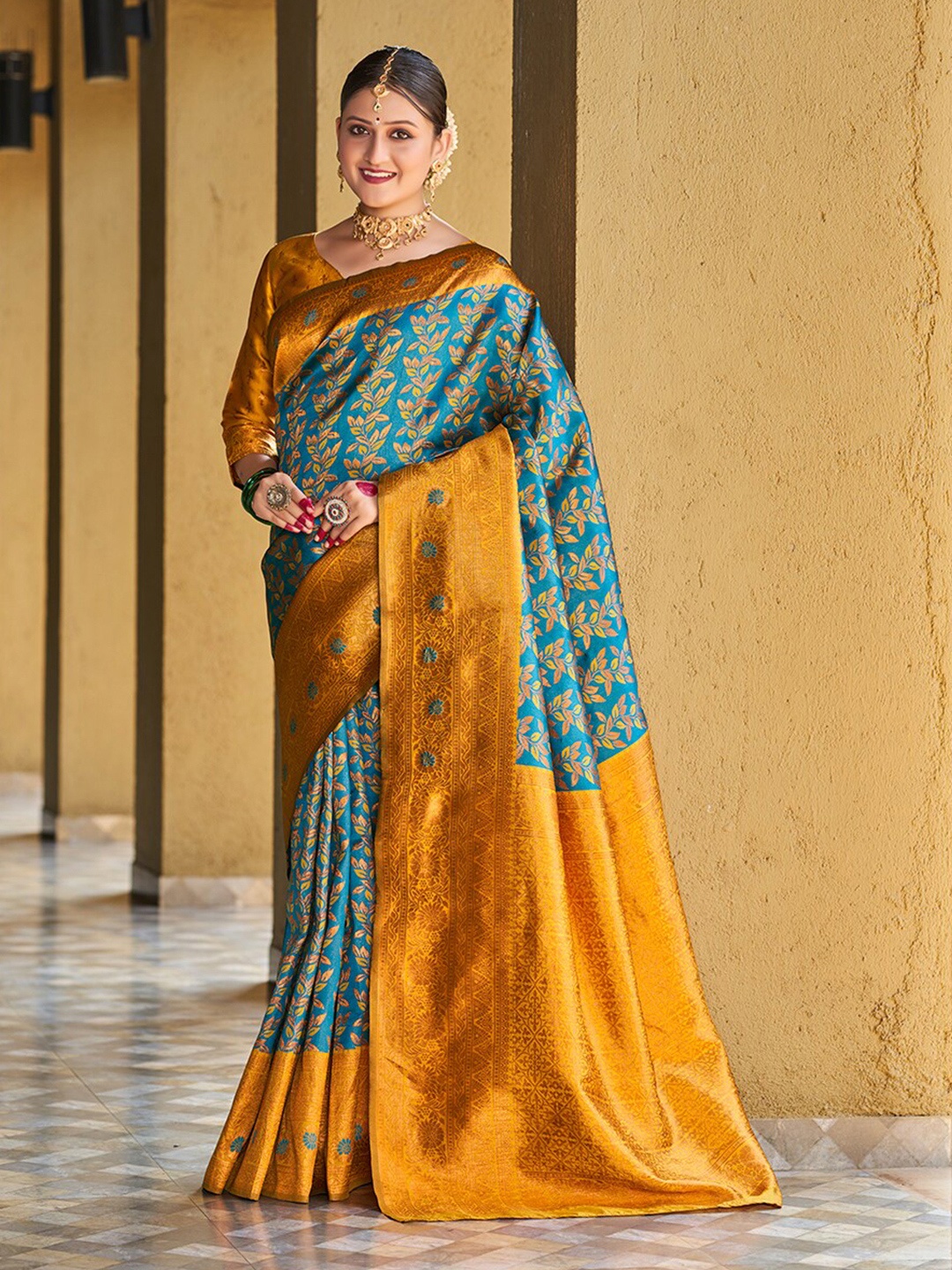 

Mitera Teal & Yellow Ethnic Motifs Woven Design Zari Banarasi Saree