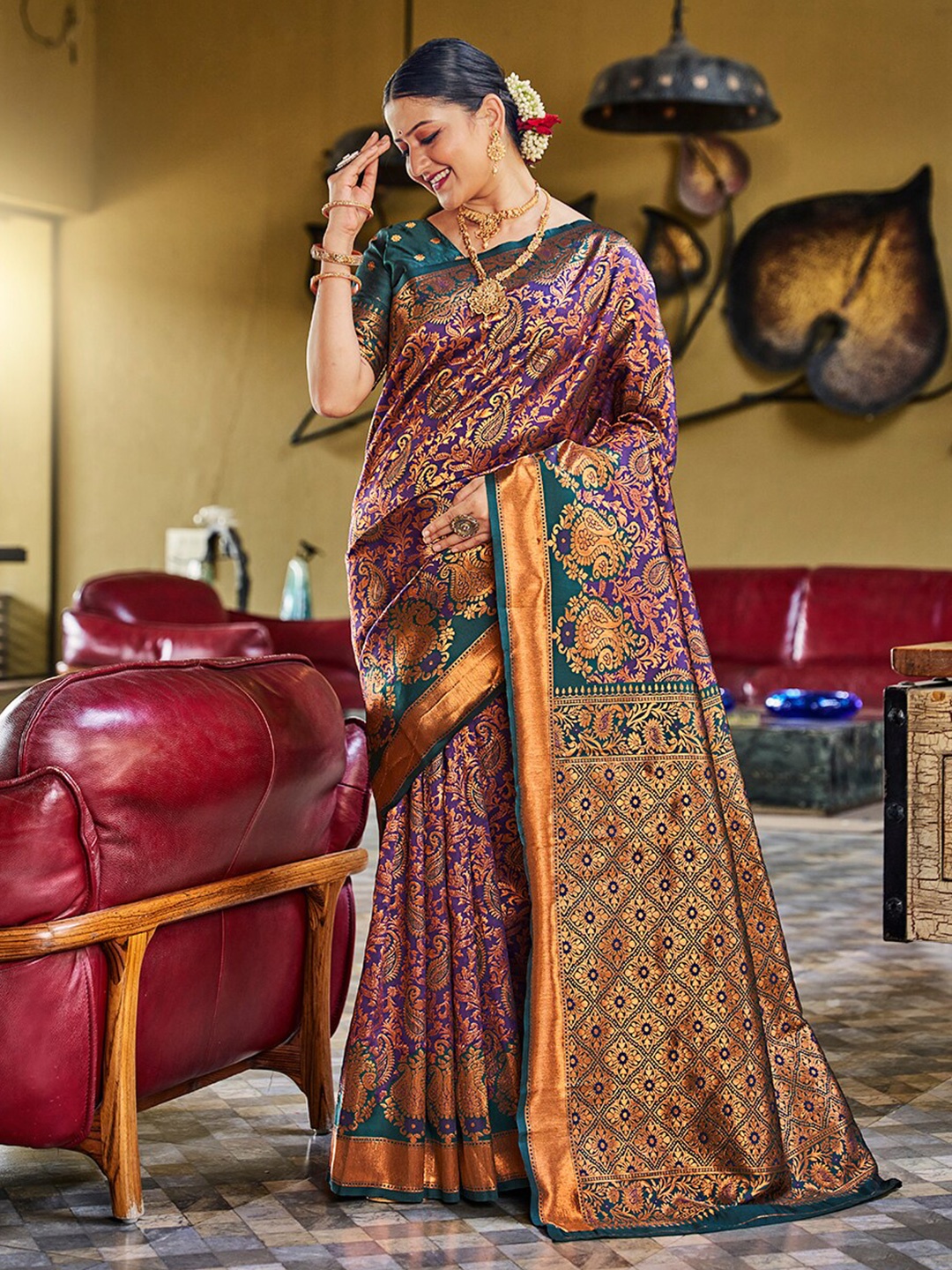 

Mitera Teal & Purple Ethnic Motif Woven Design Zari Banarasi Sarees