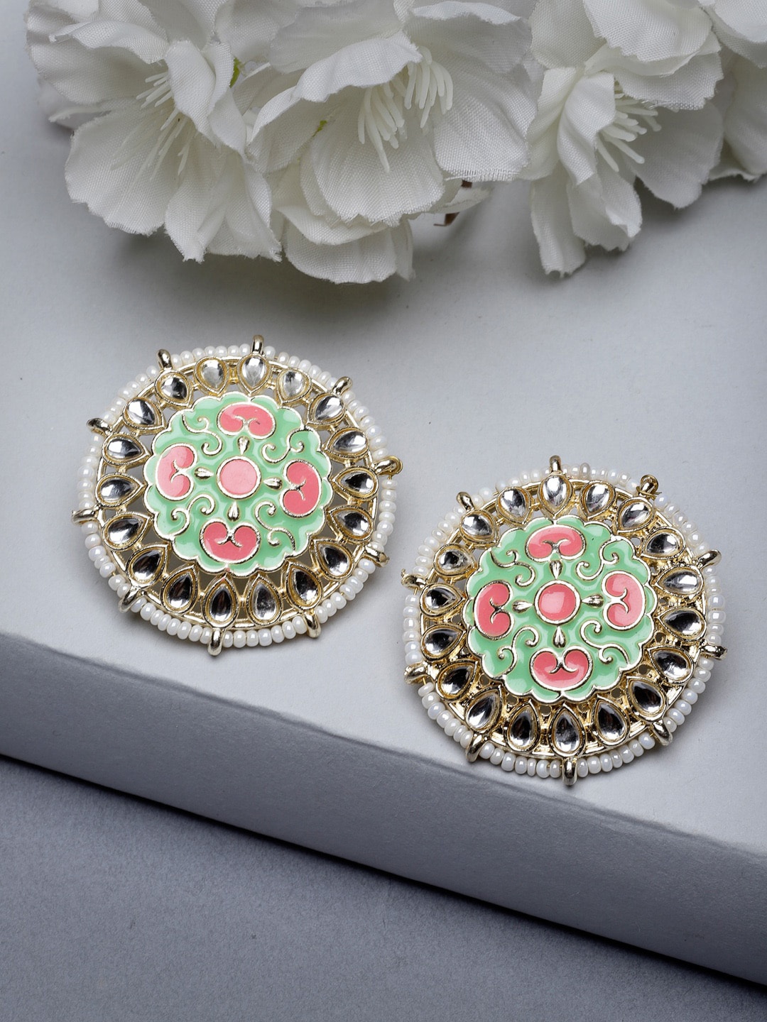 

Sukkhi Gold Plated Kundan Studded Contemporary Enamelled Studs Earrings