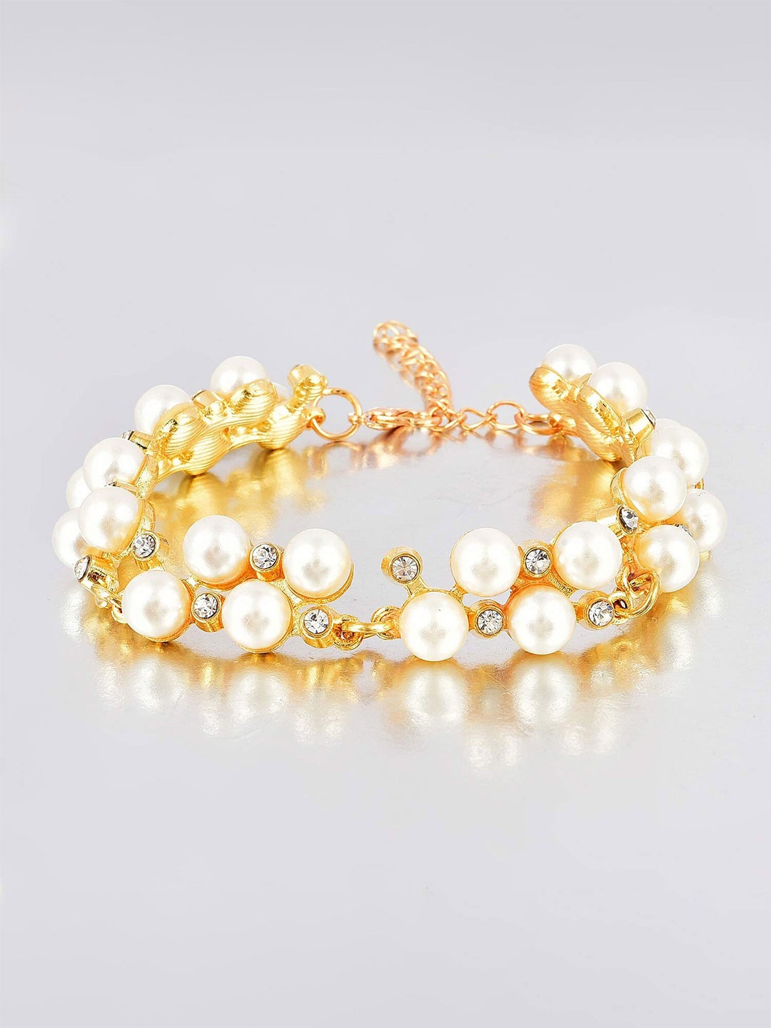 

Yellow Chimes Gold Plated Pearl Studded Multistrand Bracelet