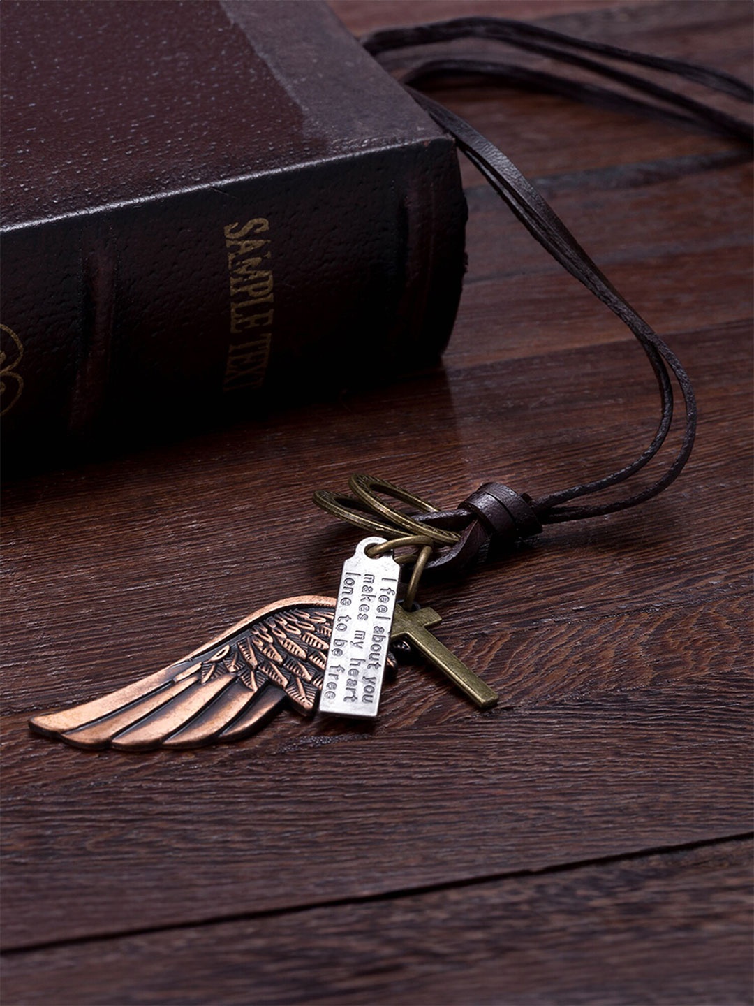 

Yellow Chimes Feather Cross Angel Necklace, Brown