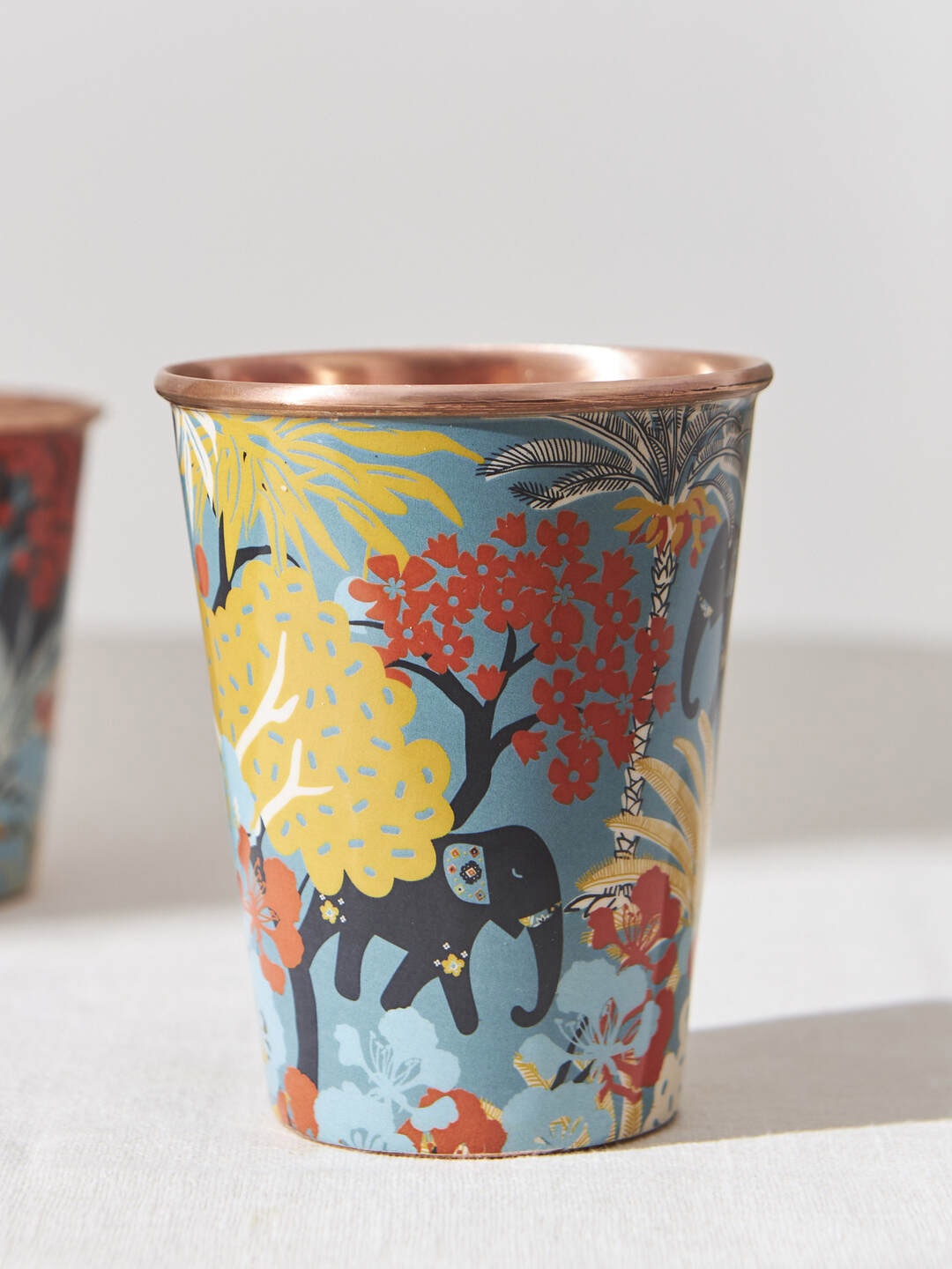 

Chumbak Jungle Drama Teal Blue & Yellow Printed Copper Tumbler