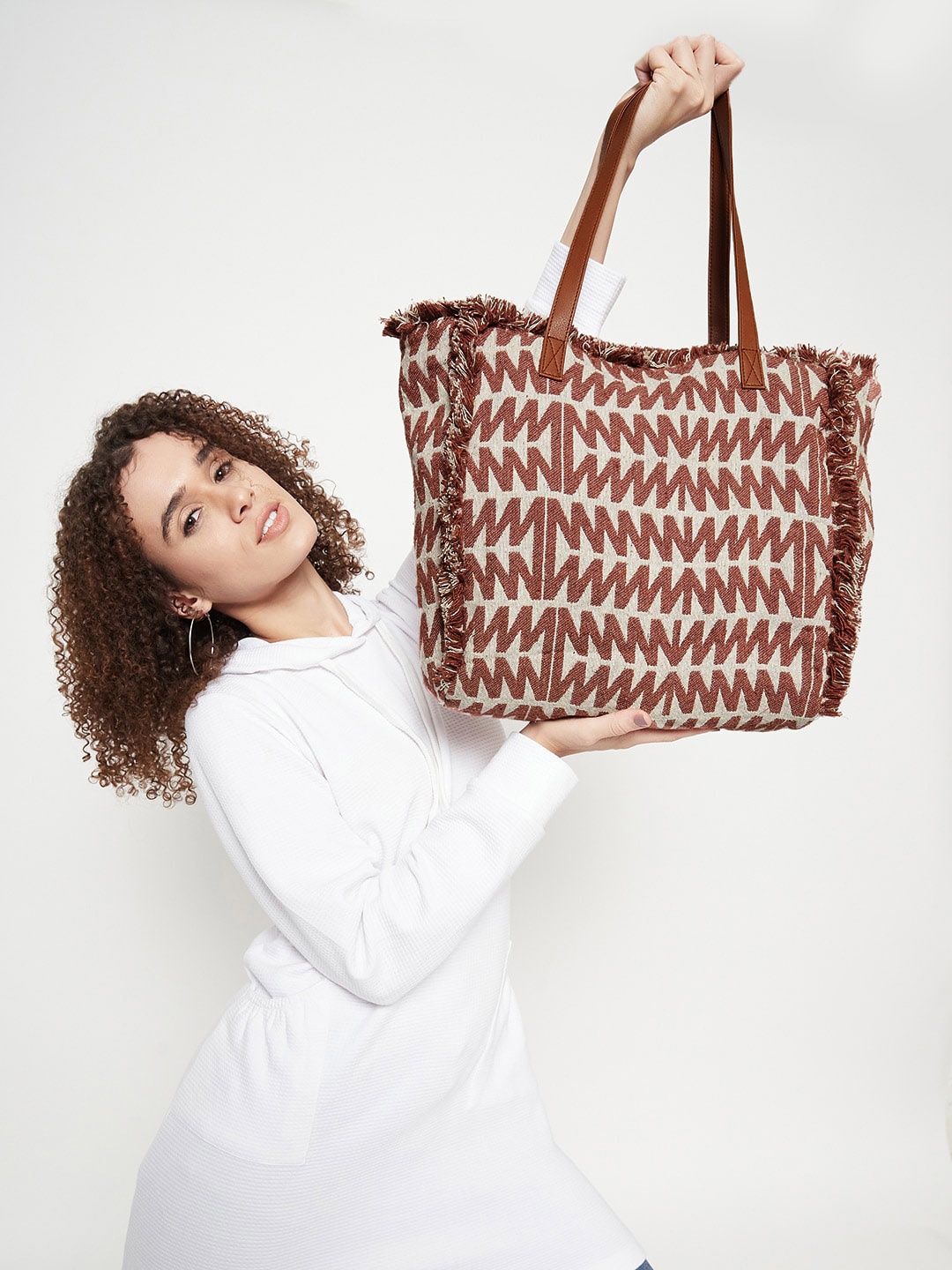 

Anouk Coffee Brown Geometric Printed Cotton Handheld Bag With Tasselled